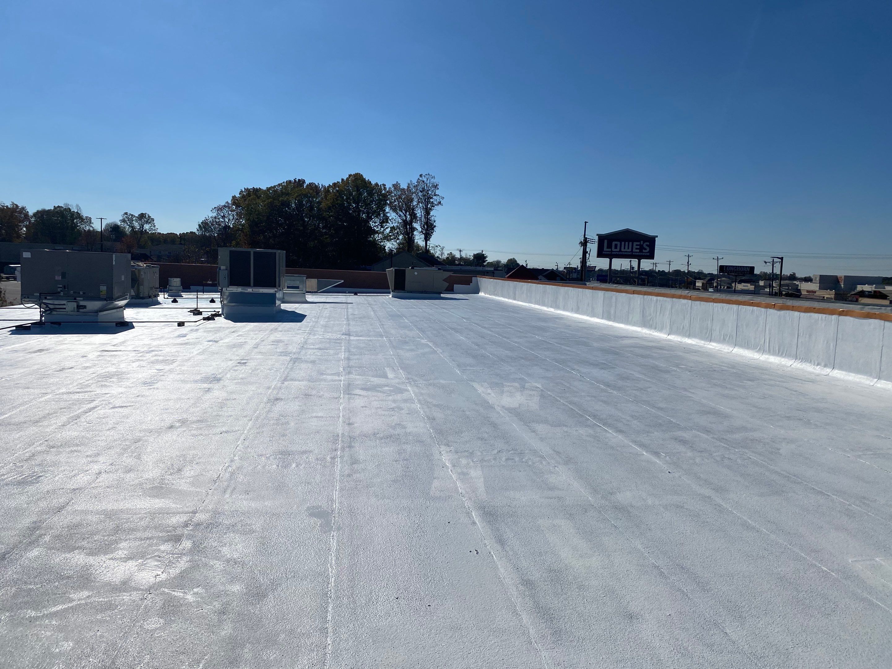 Commercial Coating using Poly Urerthane and Silicone Coating by Just In Time Roofing and Restoration