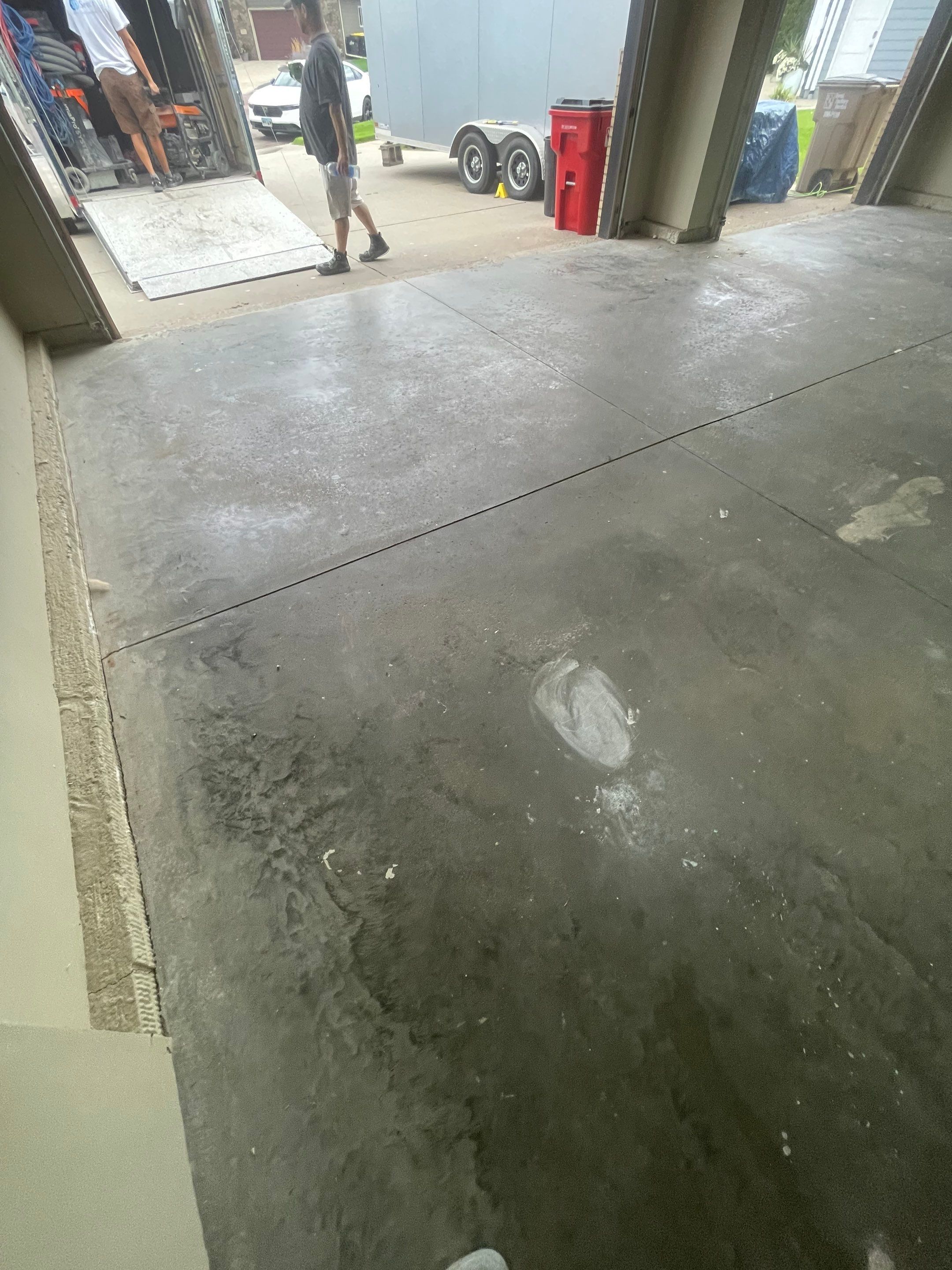 Cabin FEver Flake Garage Floor Coating Installation in Sioux Falls by Select Painting, Coatings & Garage Cabinets