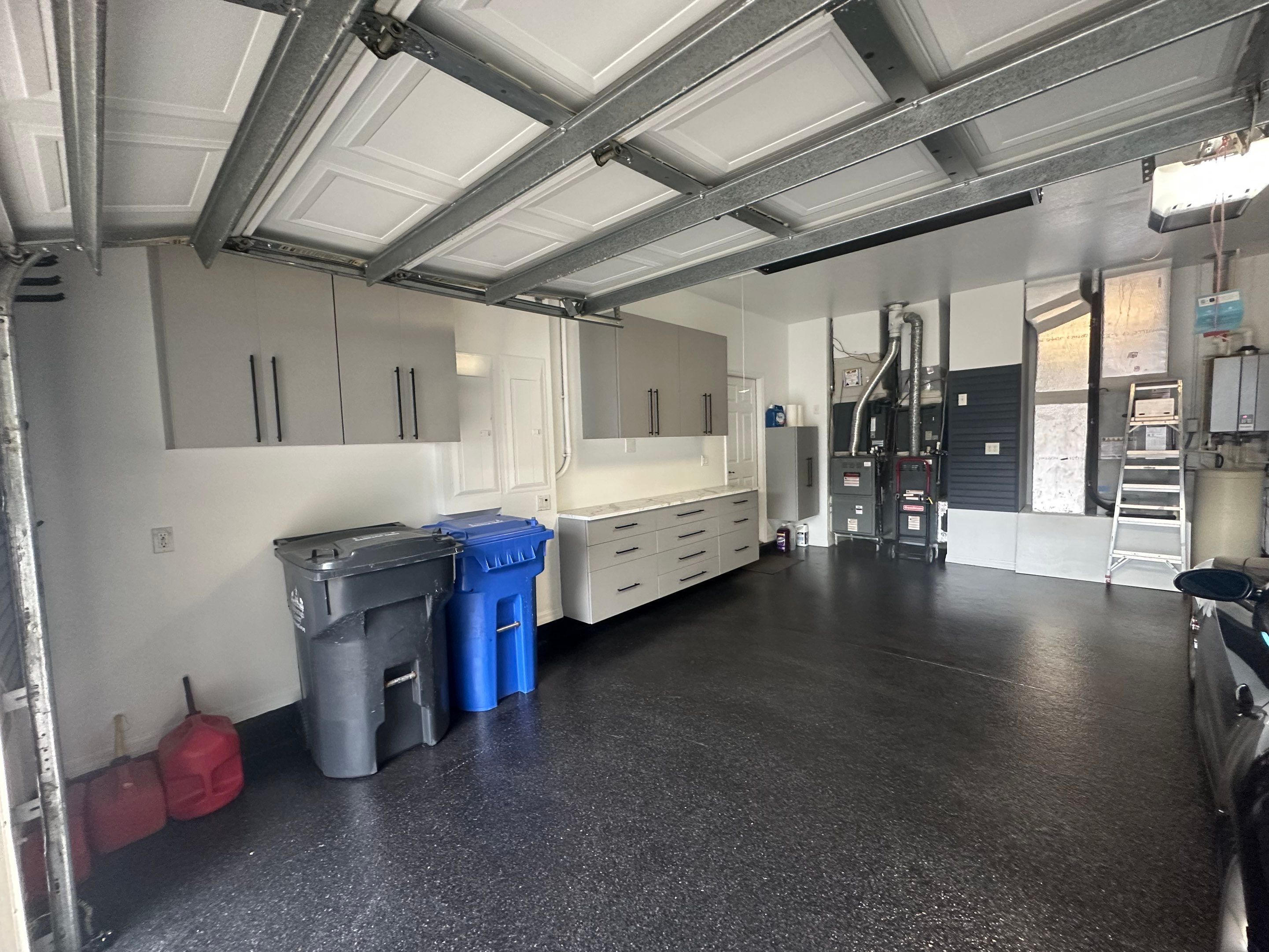 Tampa Garage Floor Coating and Overhead Storage Rack Installation by Square 1 Garage and Closet Solutions