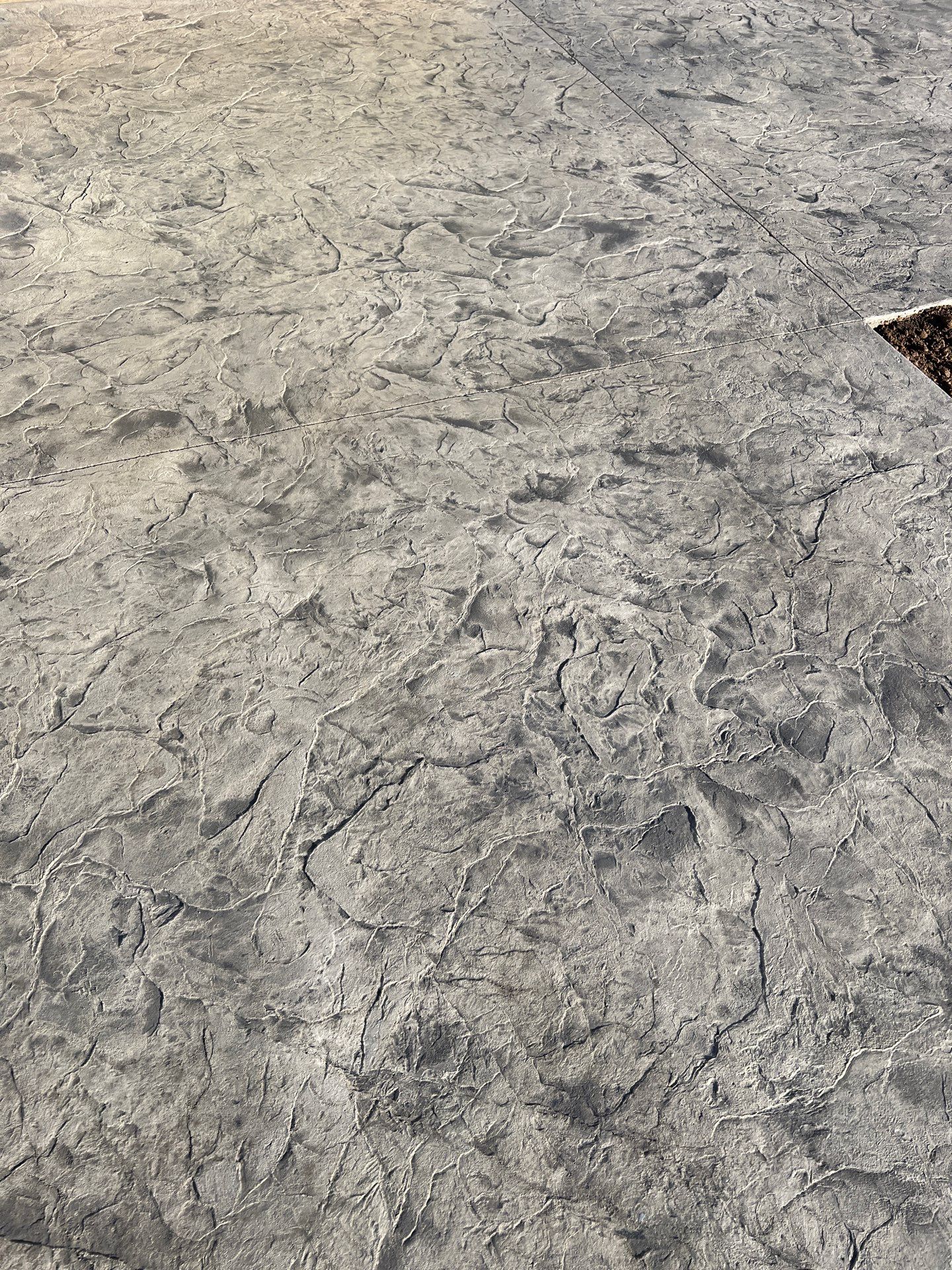 Oxford Slate stamped concrete patio  by NG Masonry & Construction LLC