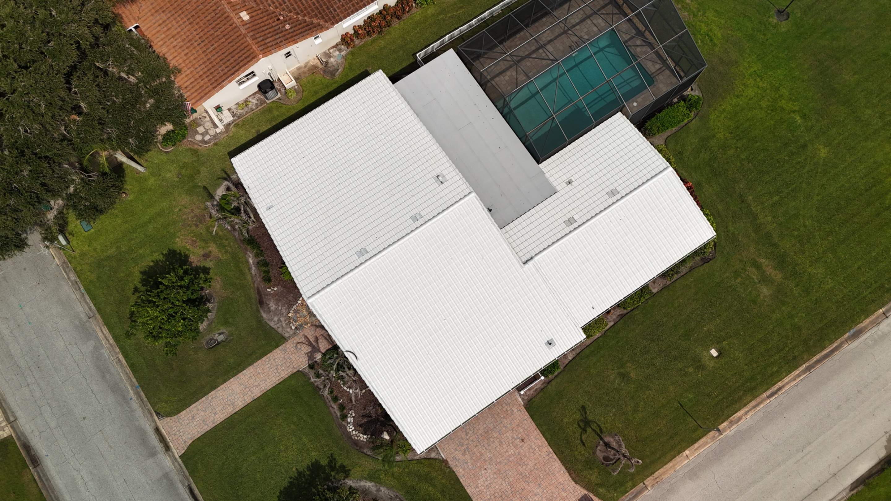 Comprehensive Concrete Tile and Flat Membrane Roof Replacement in Cocoa Beach by Wiedmann Construction & Roofing