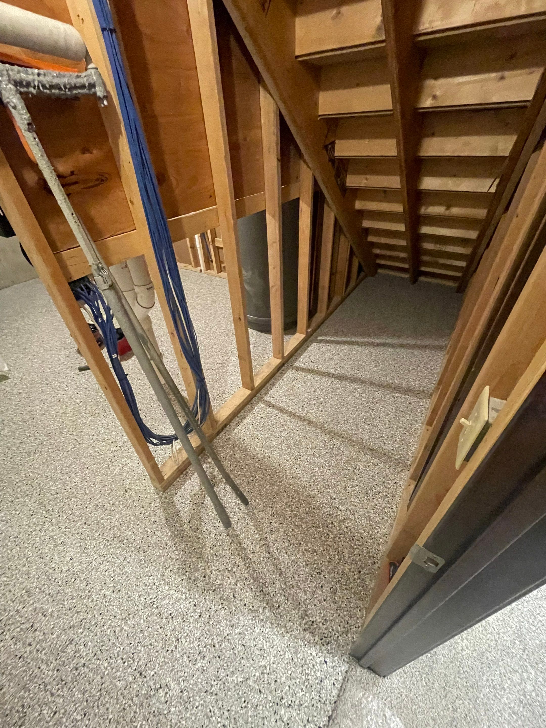 Sioux Falls Basement Floor Transformation with Durable Epoxy Flake Coating by Select Painting, Coatings & Garage Cabinets