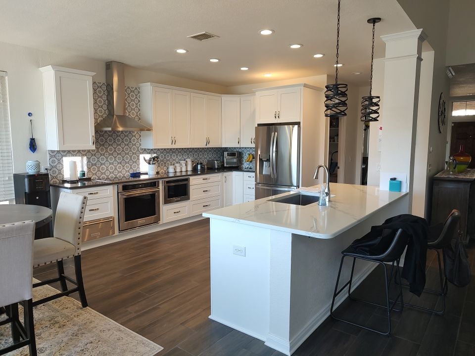 Stone Oak San Antonio Kitchen Remodel Featuring Custom White Cabinetry & Expanded Island by Legacy Bath and Kitchen 