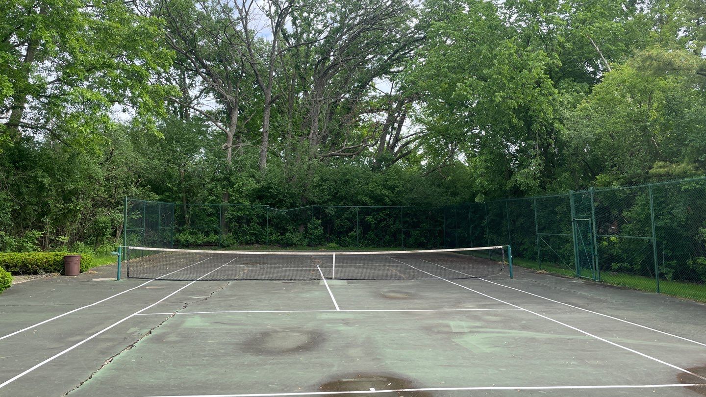 Tennis Court using Algaecide, soft wash soap by Northern Power Washing LLC.
