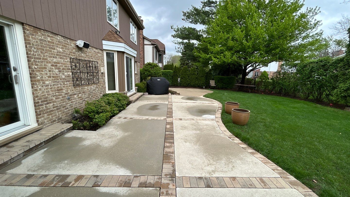 concrete patio and driveway cleaning by Northern Power Washing LLC.