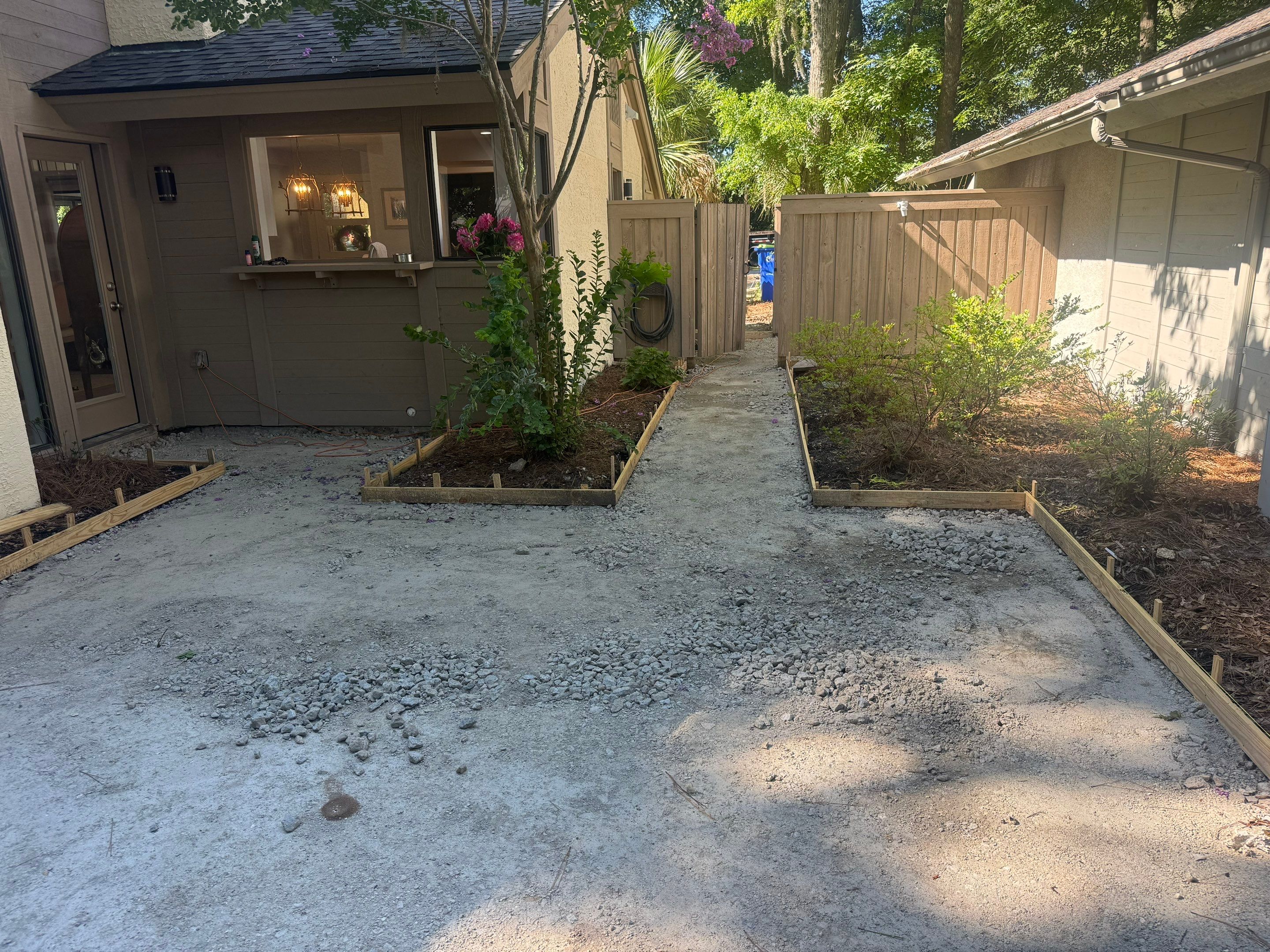 Custom Concrete Patio and Herringbone Paver Walkway in Hilton Head Island by Lowcountry Scapes, LLC