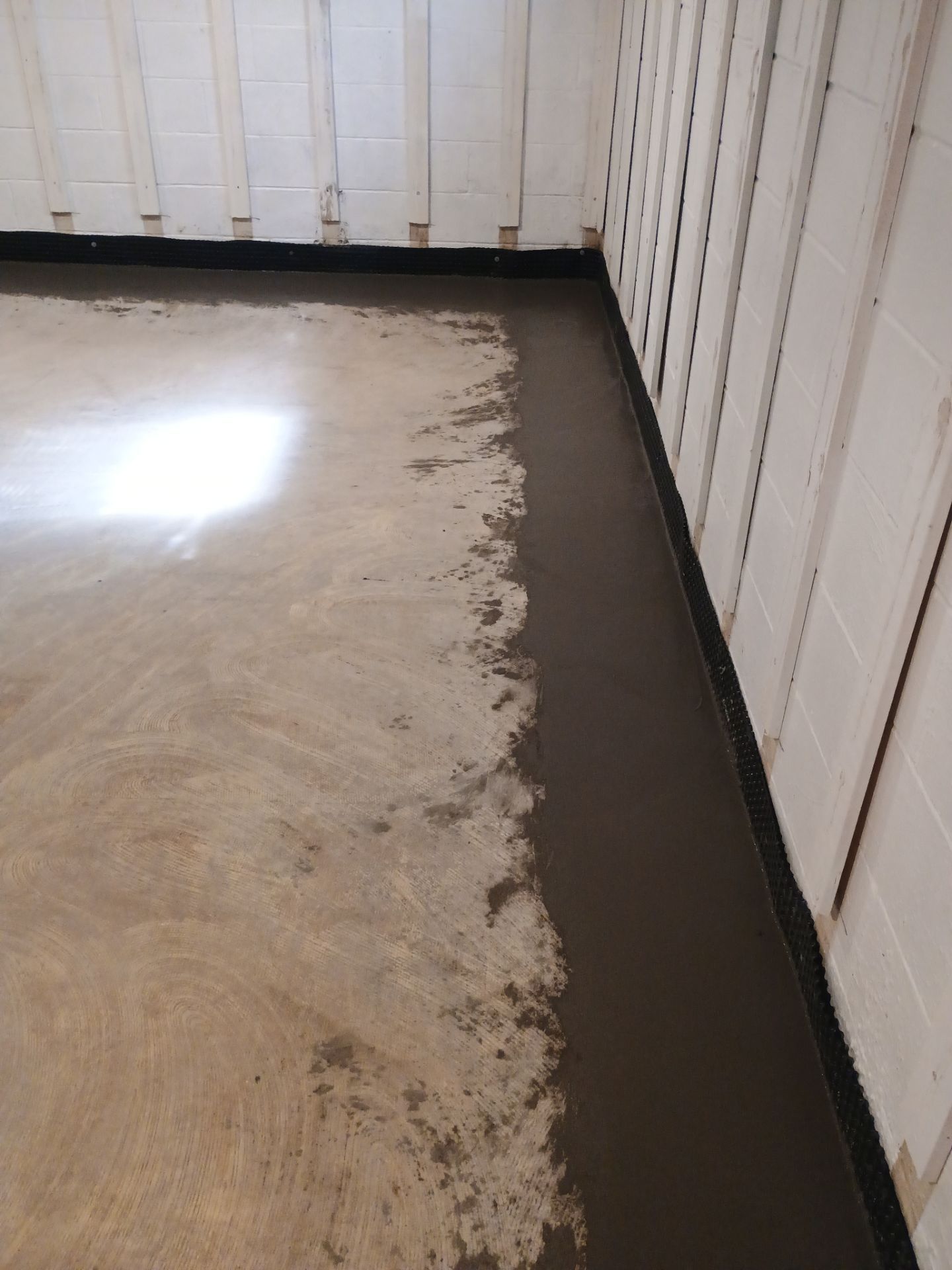 Interior Drain Tile & Buried Discharge in St. Anthony, MN by Waterproofing Northeast