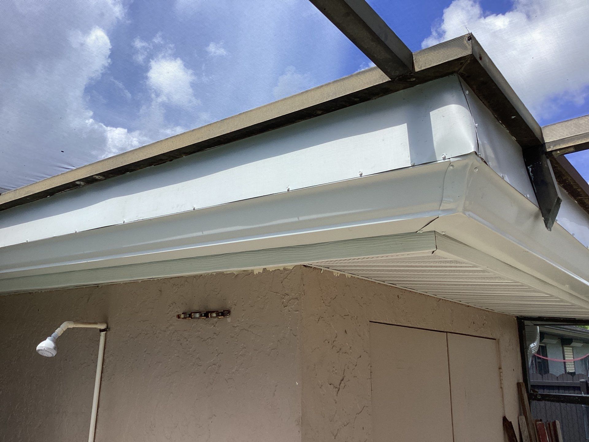 White Seamless Gutters and Splash Guards in Fort Myers FL by Gutter Professor by Gutter Professors