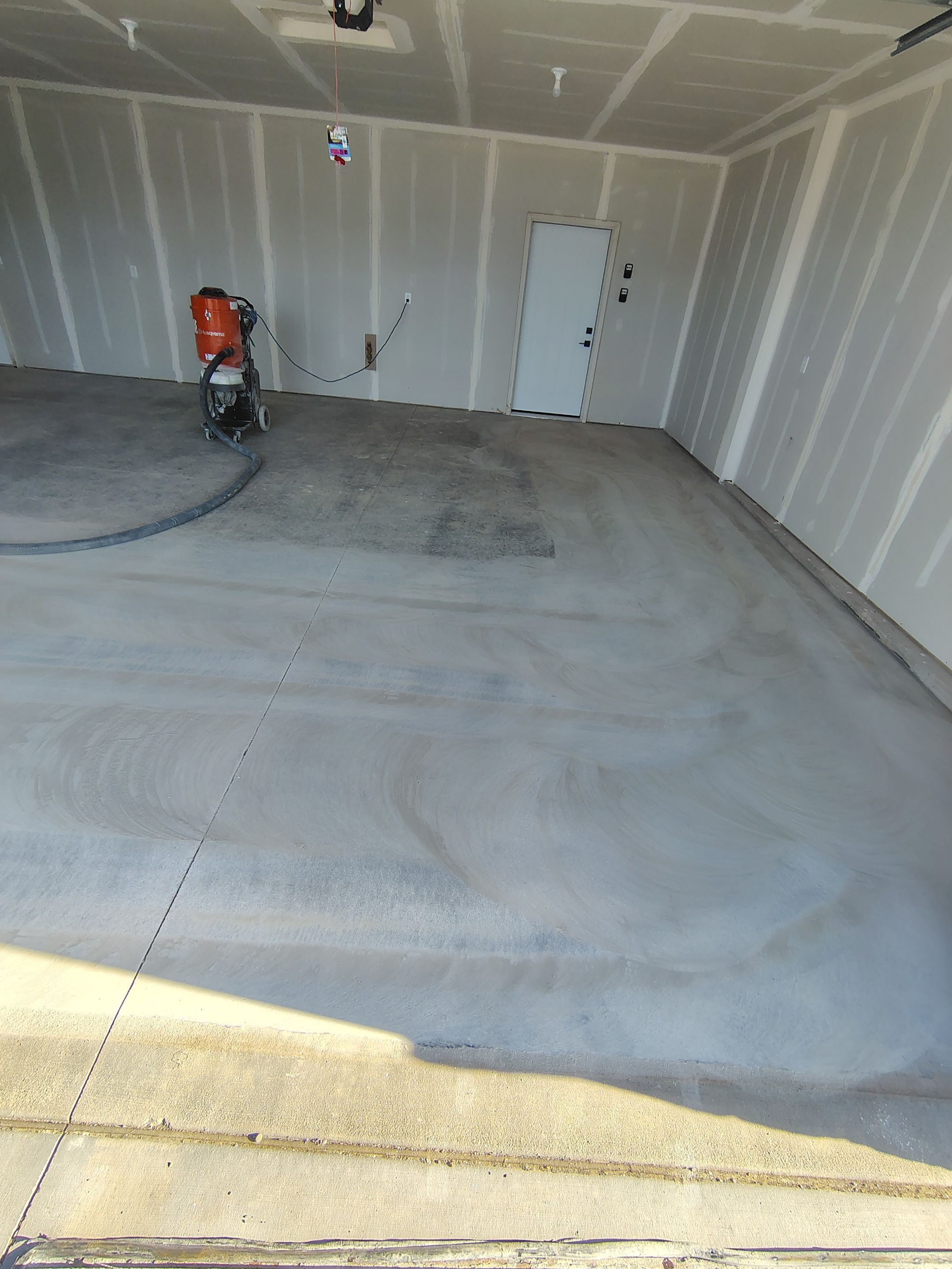 Speckled Epoxy Garage Floor Coating Installation in Sioux Falls by Select Painting, Coatings & Garage Cabinets