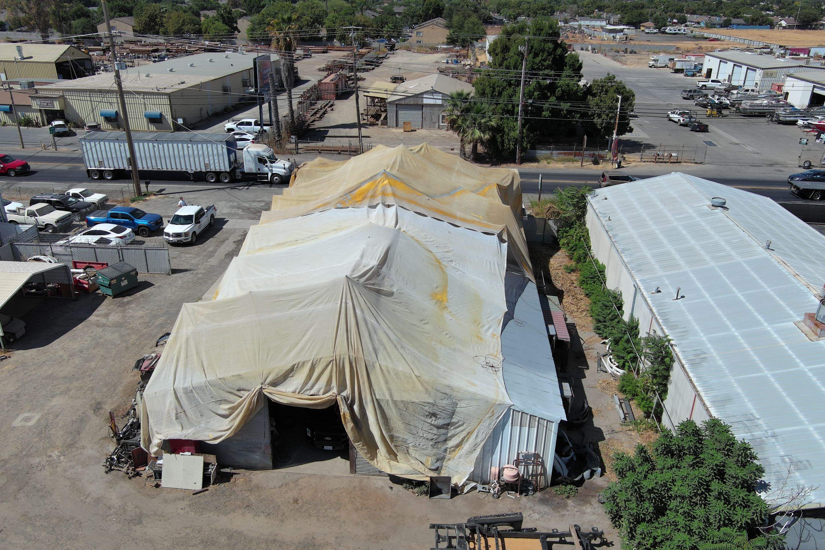 Spray foam and coatings using Conklin Benchmark/ PUMA XL acrylic coatings over metal and foam by Straight Edge Roofing Inc