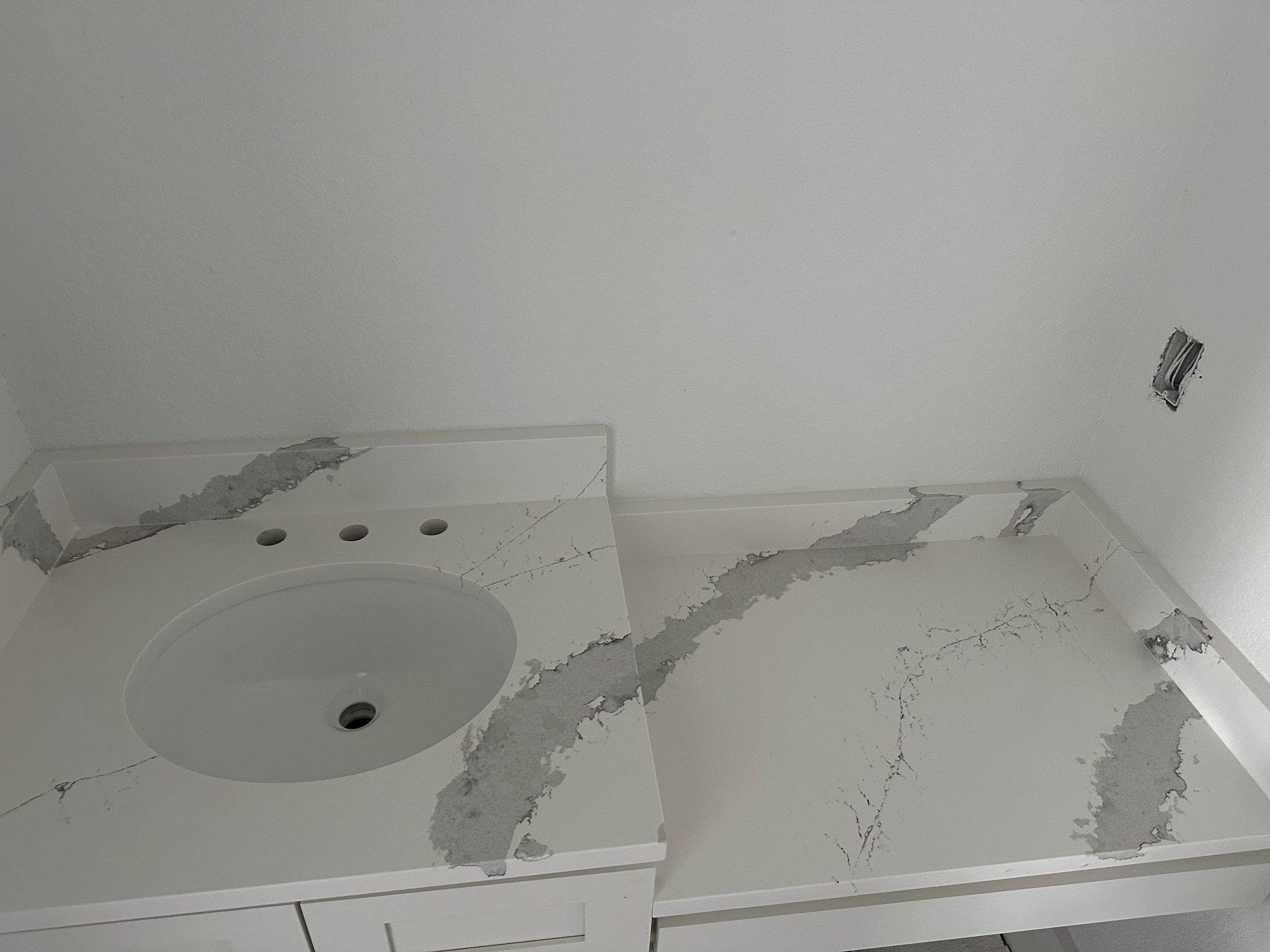 Kitchen and Bathroom Countertop Upgrades Featuring Gray Veined Quartz by Mena stone surfaces