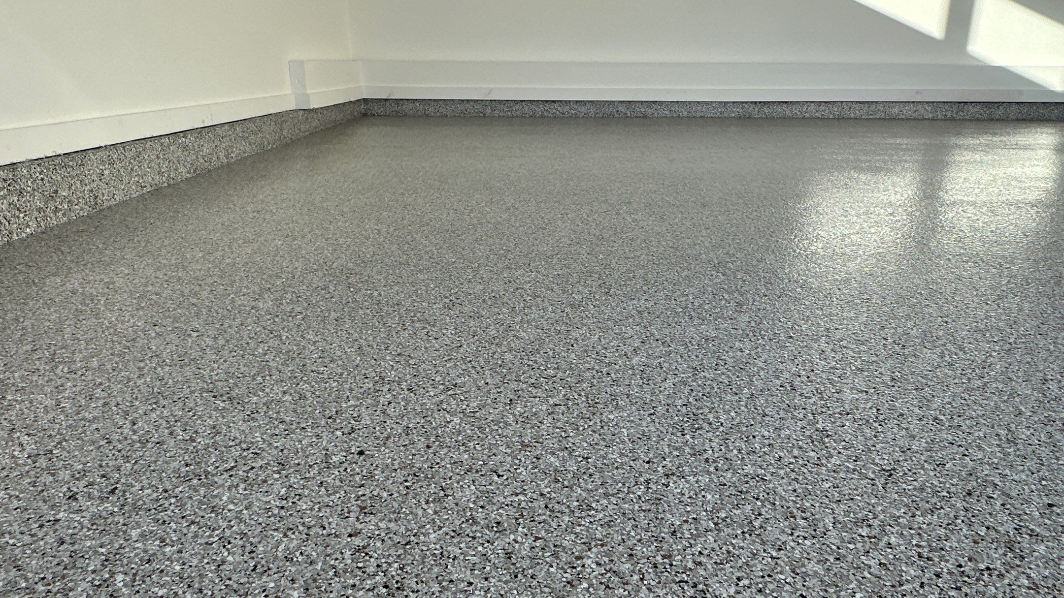 Mike M. got him self a beautiful Coyote flake floor by Banner Garage