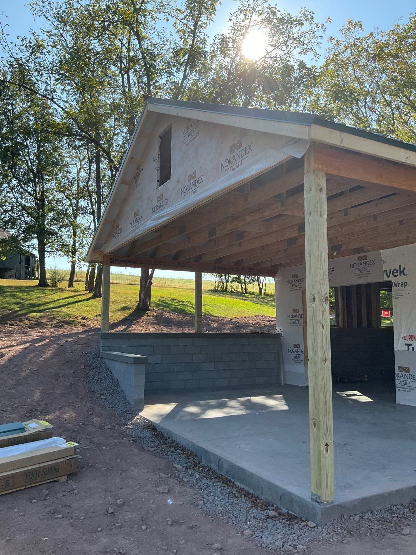 Detached Garage Construction with Vinyl Siding and Metal Roof by Esh Builders