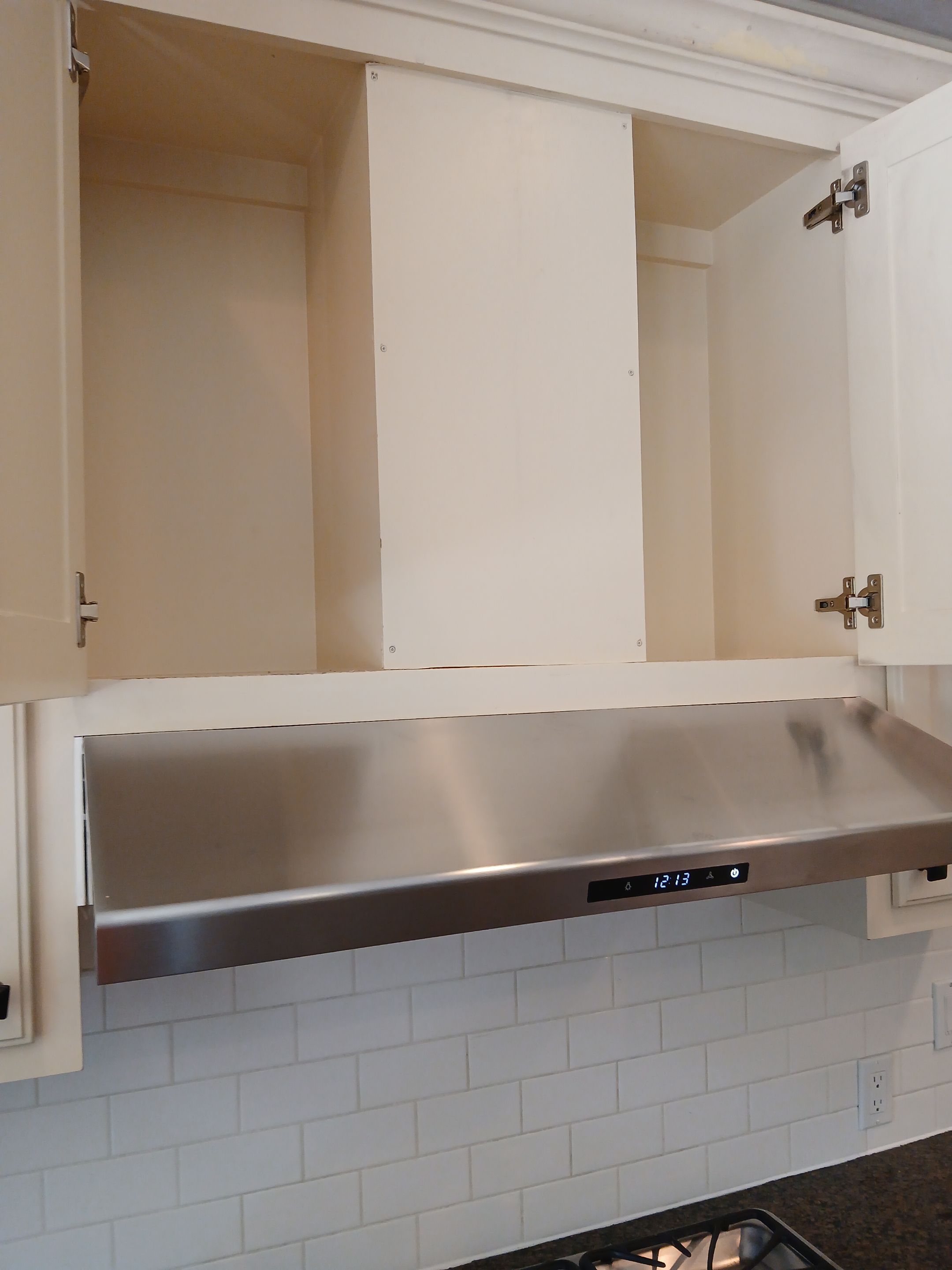 Under-Cabinet Range Hood Installation with Vent Ducting in Austin by RejuveNate Renovations LLC