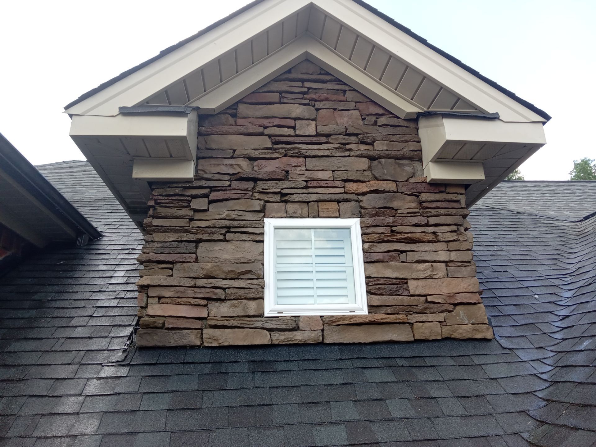 pressure washing exterior surfaces including stone facade and siding