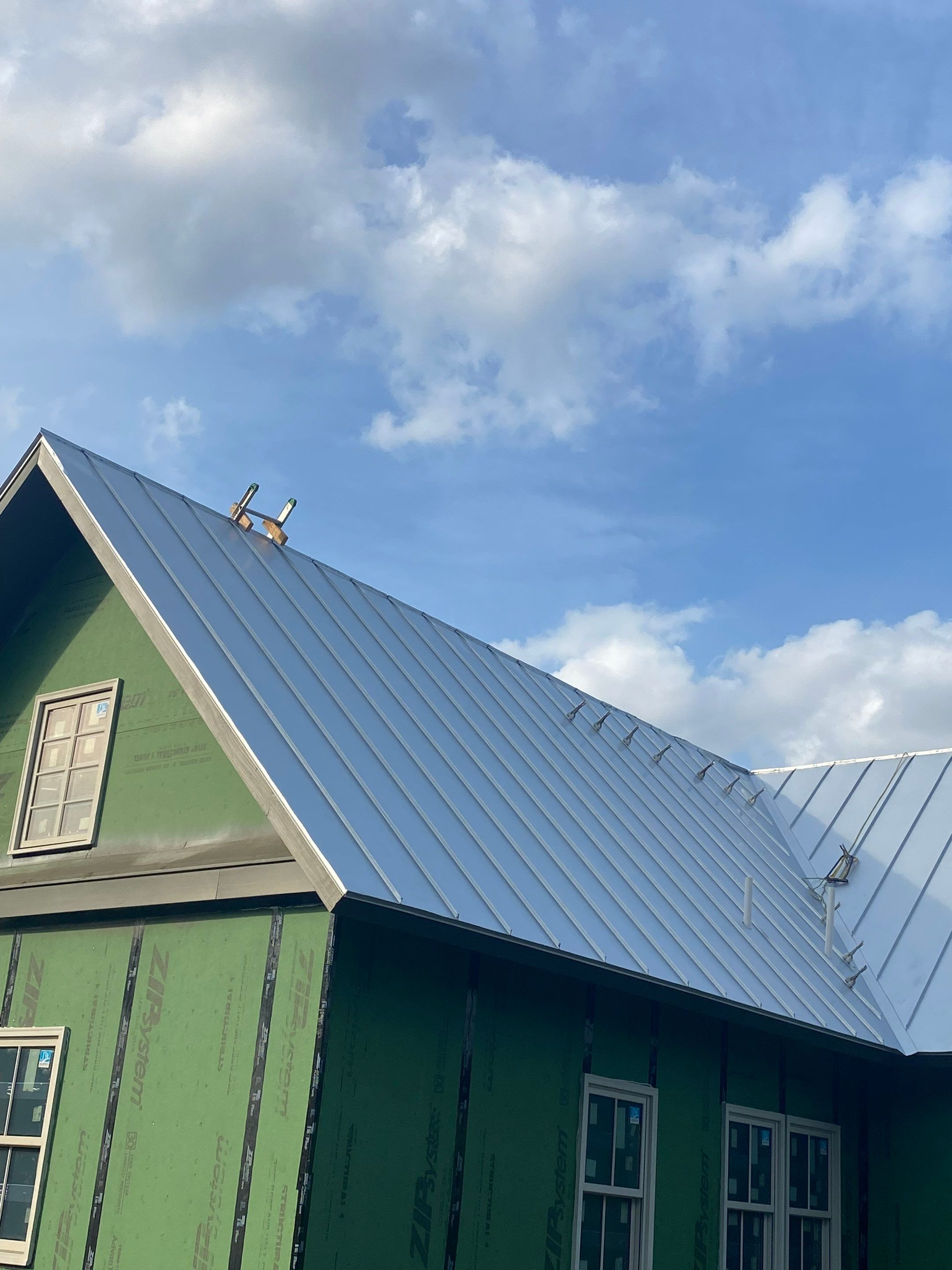 Residential Metal Roof Installation using McElroy Metal by Premier Roofing and Contracting