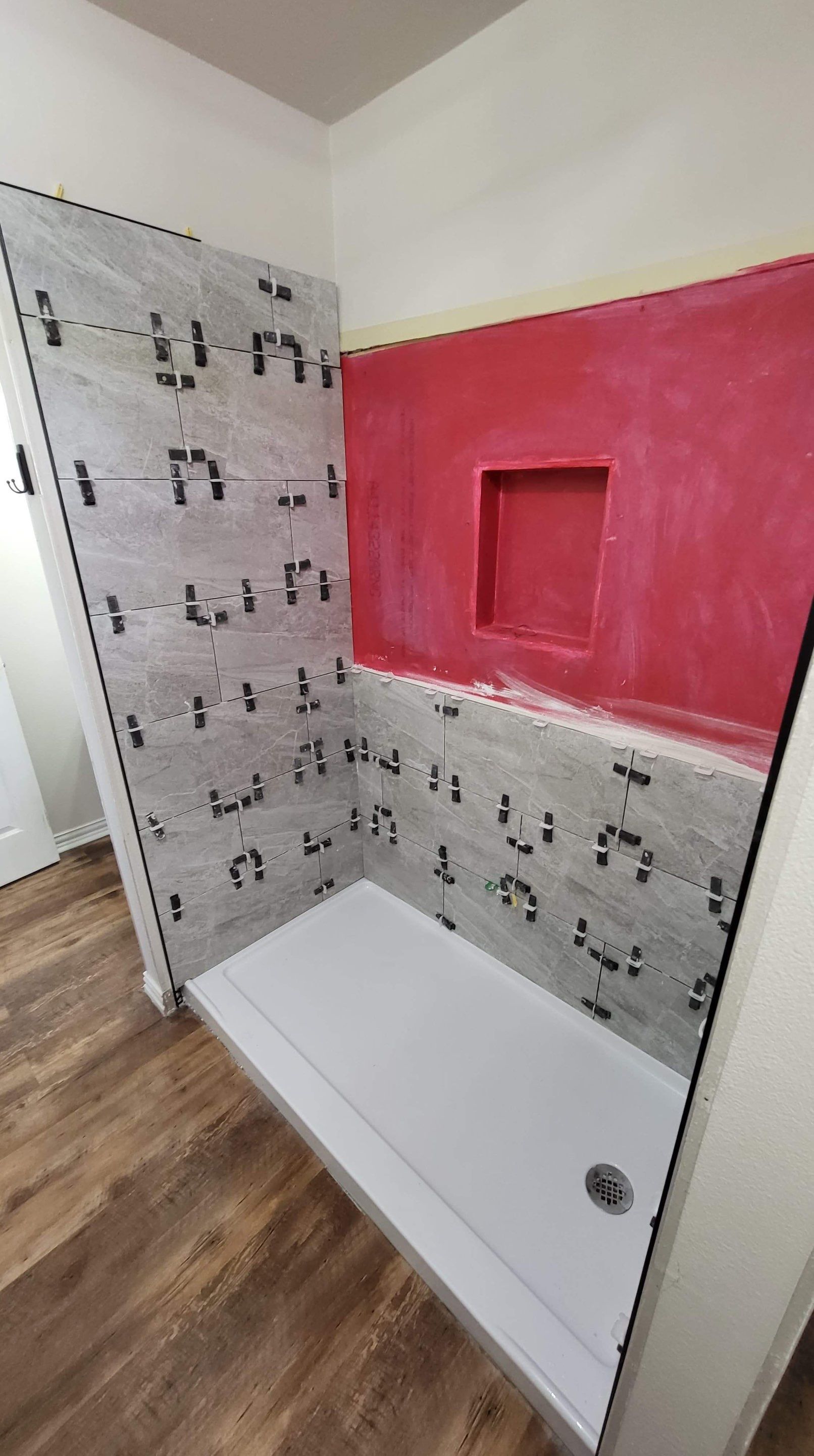 Bathroom Remodel using Tile  by SLM General Contractors & Roofing
