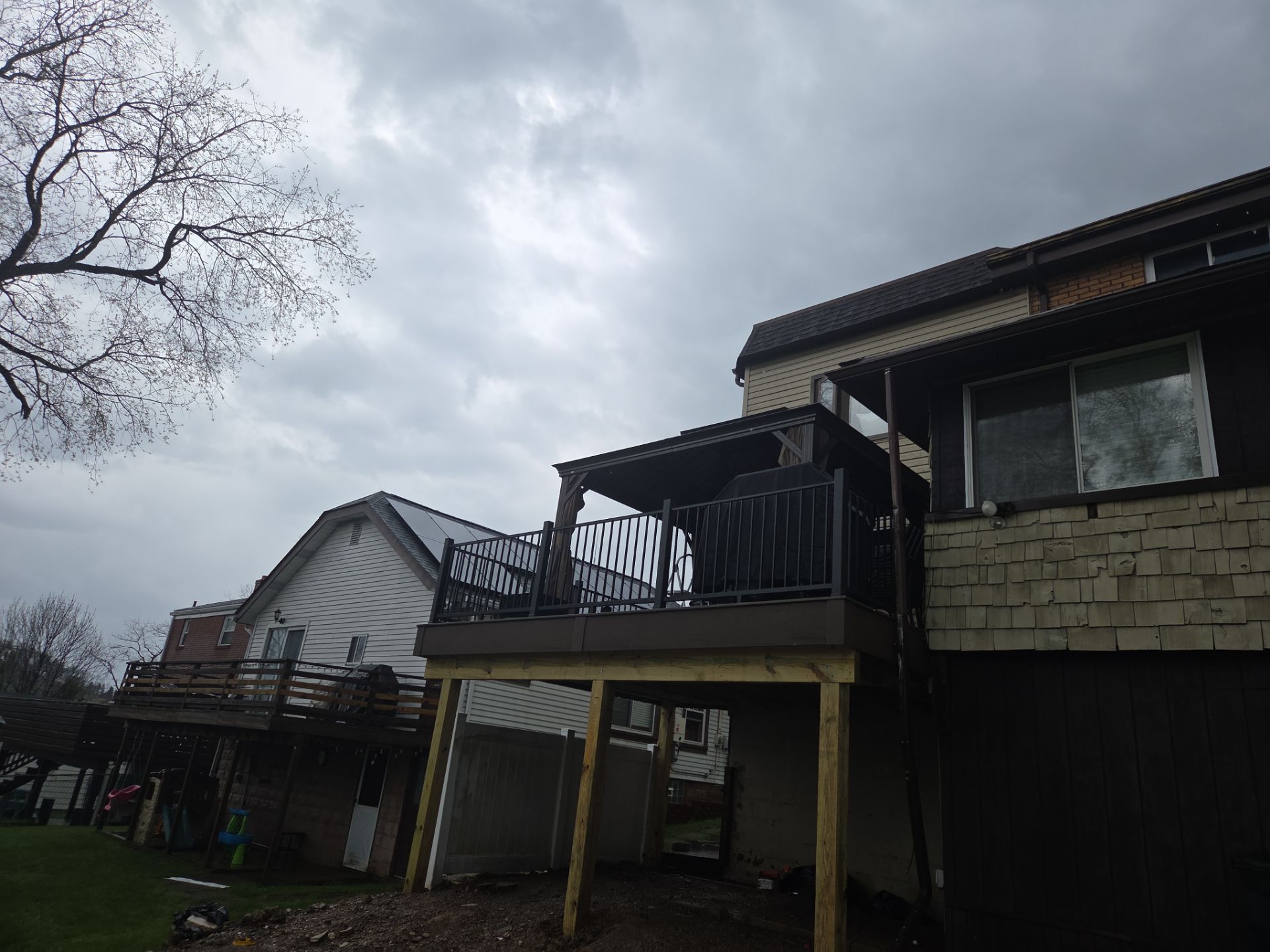 Custom Composite Deck and Wood-Plank Stamped Concrete Patio in Pittsburgh by Cousins Roofing Siding & Decks
