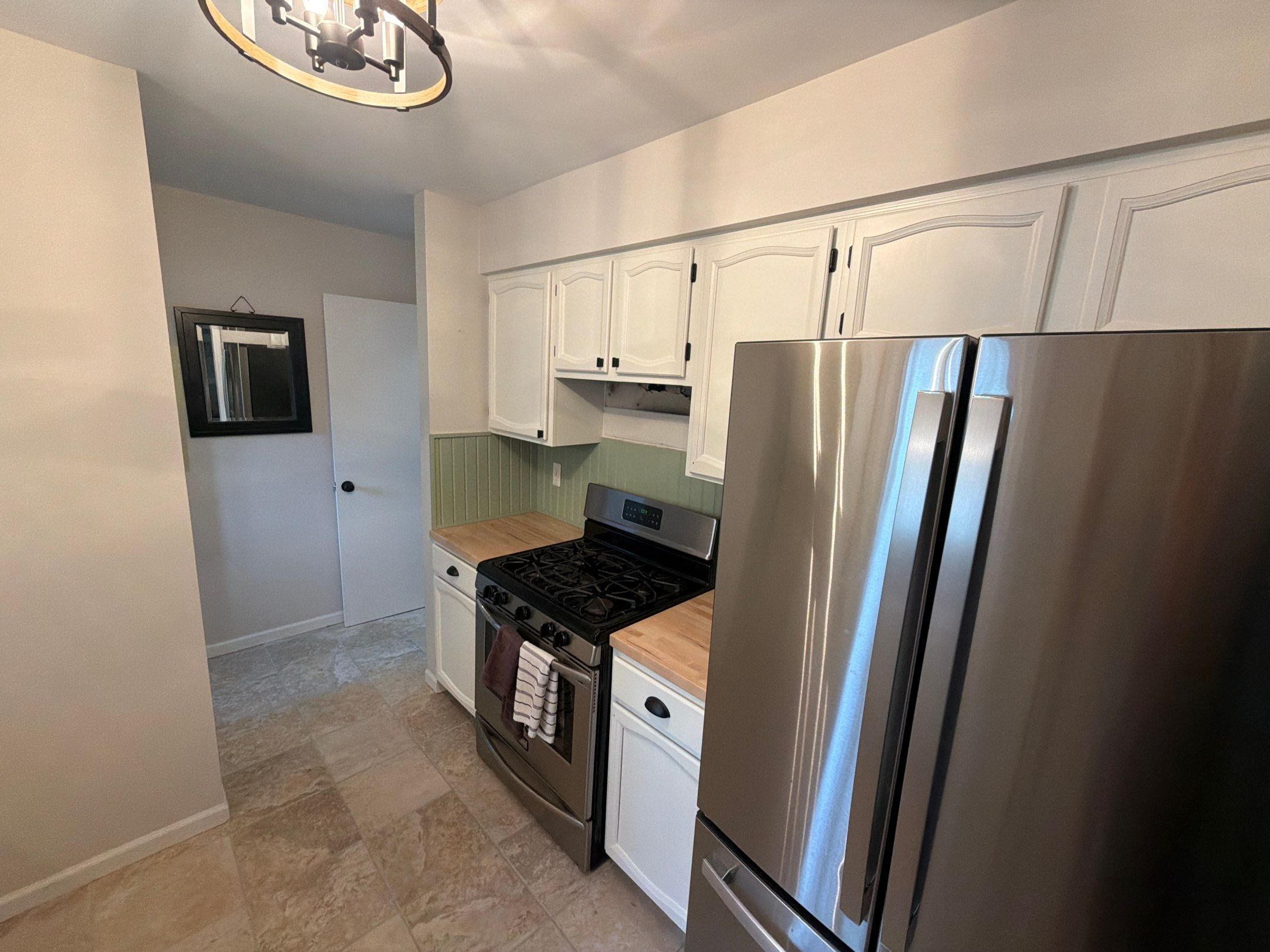 Kitchen Cabinet Refinishing and Butcher Block Countertop Installation in Fenton by Top Shelf Painter