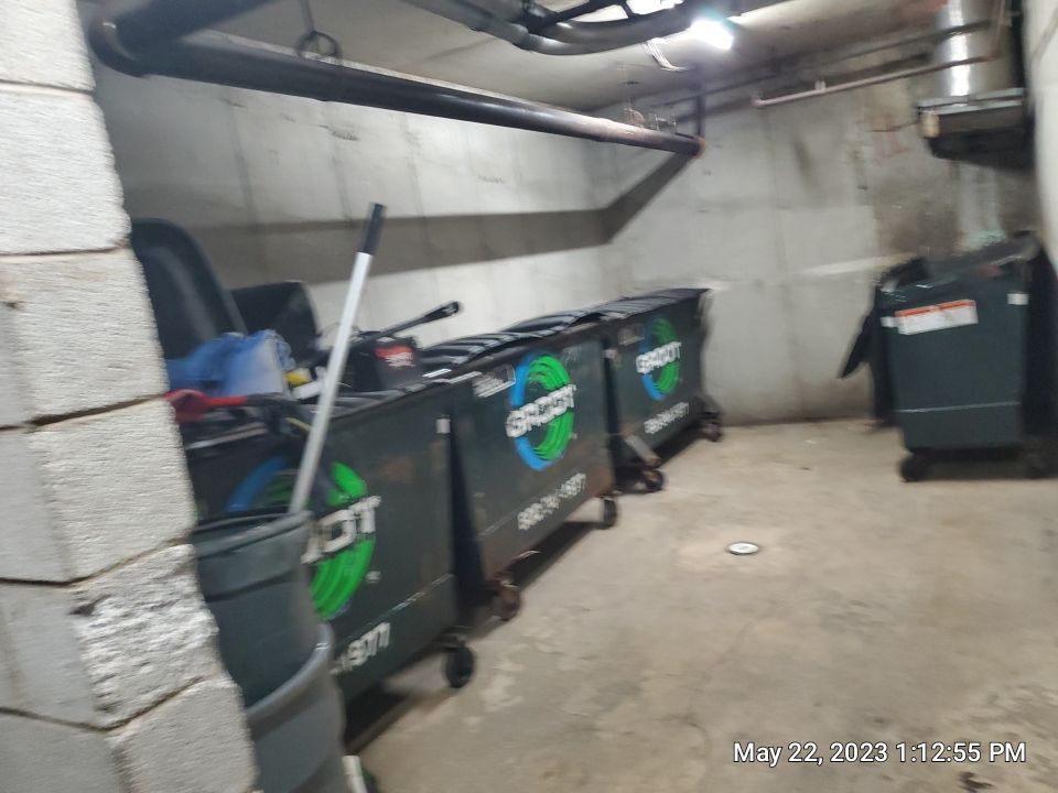 Parking garage using Hot water by Northern Power Washing LLC.