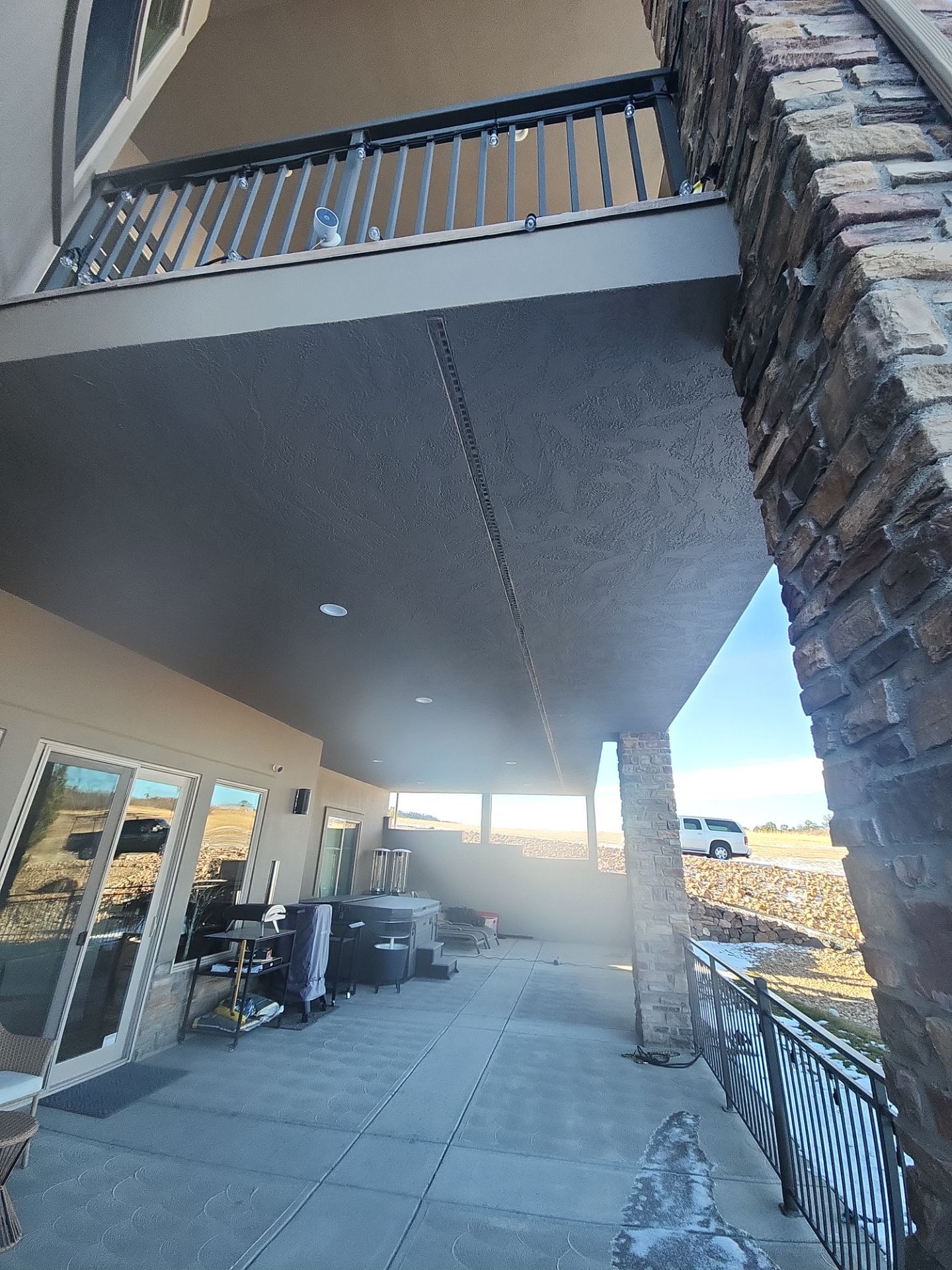 Castle Rock Elegance: White Stucco Exterior with Bold Tricorn Black by J&M Painting LLC