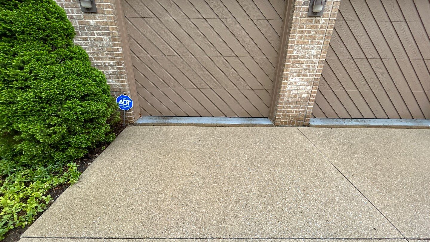 concrete patio and driveway cleaning by Northern Power Washing LLC.