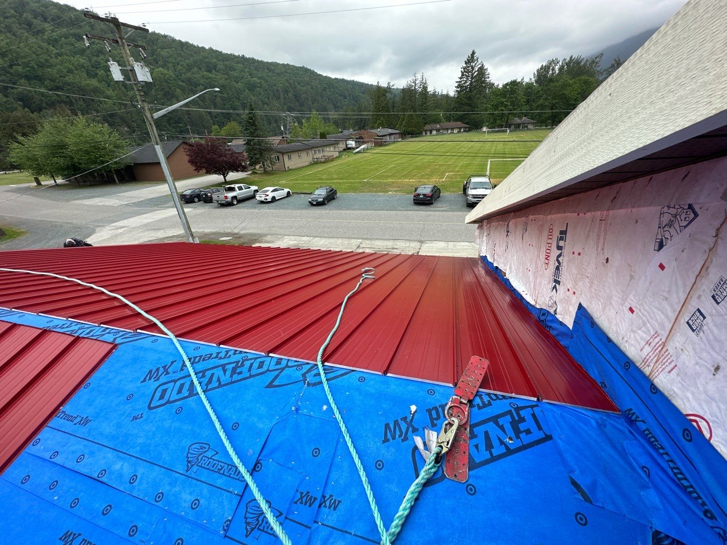 Commercial Roofing Installation using 12" Prolok metal  by Top Notch Roofing Inc