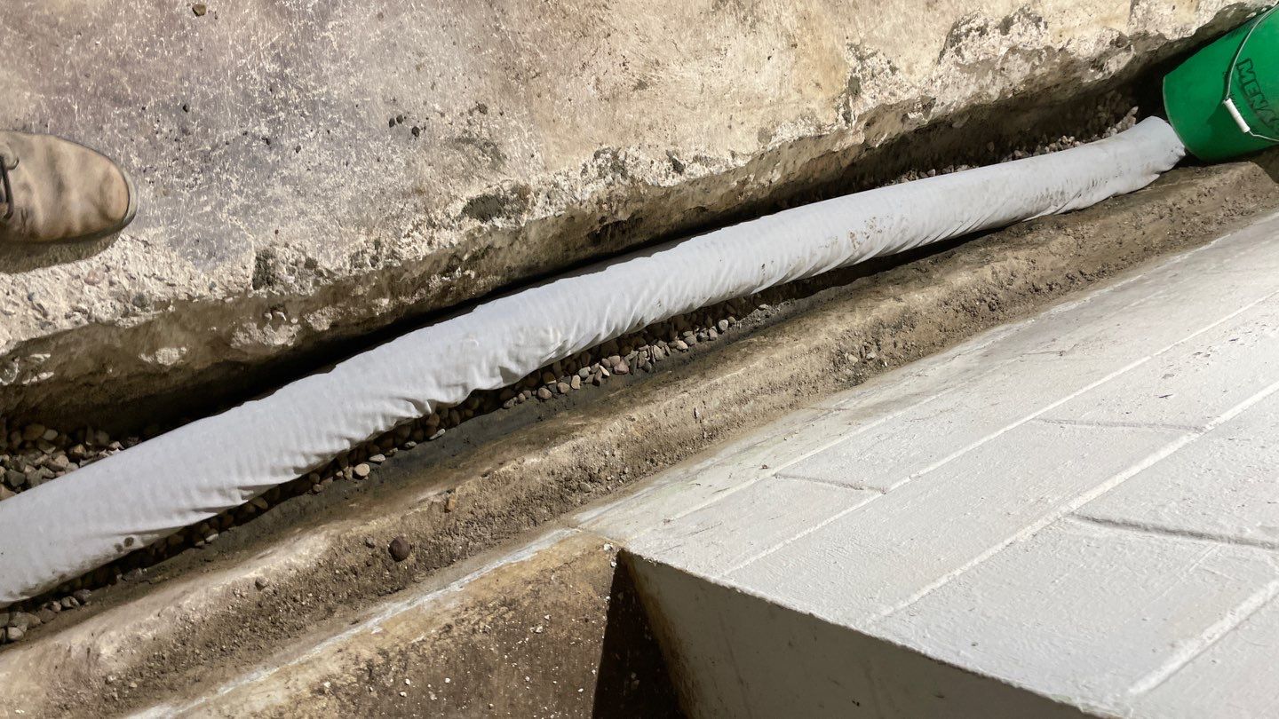 Drain tile & a sump pump for Ruth by Waterproofing Northeast