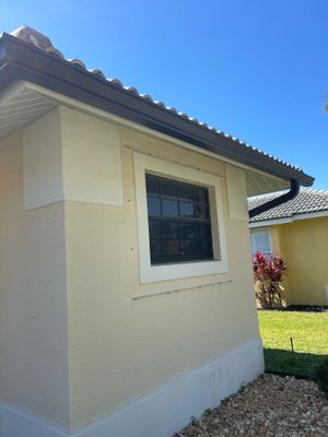 Bronze Seamless Gutters using 3X4 Elbow Downspout in Bonita Springs FL