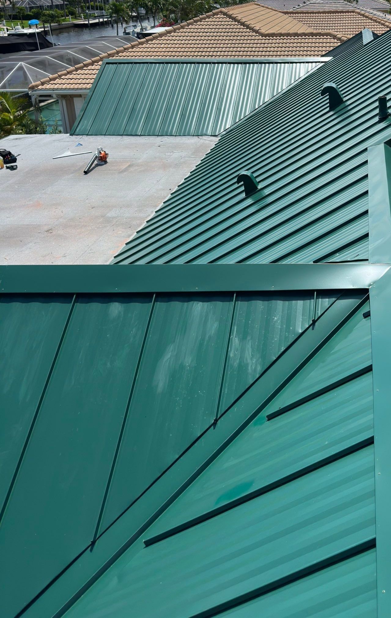 Residential Roofing Installation using Gulf Coast Metals Gulf Seam Panels by Four Peaks Roofing