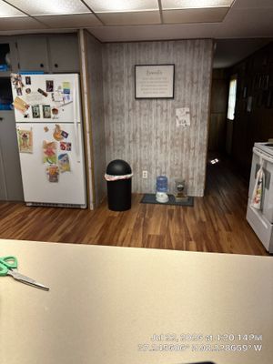 Kitchen Renovation Featuring Grey Cabinetry and Laminate Flooring in Attica
