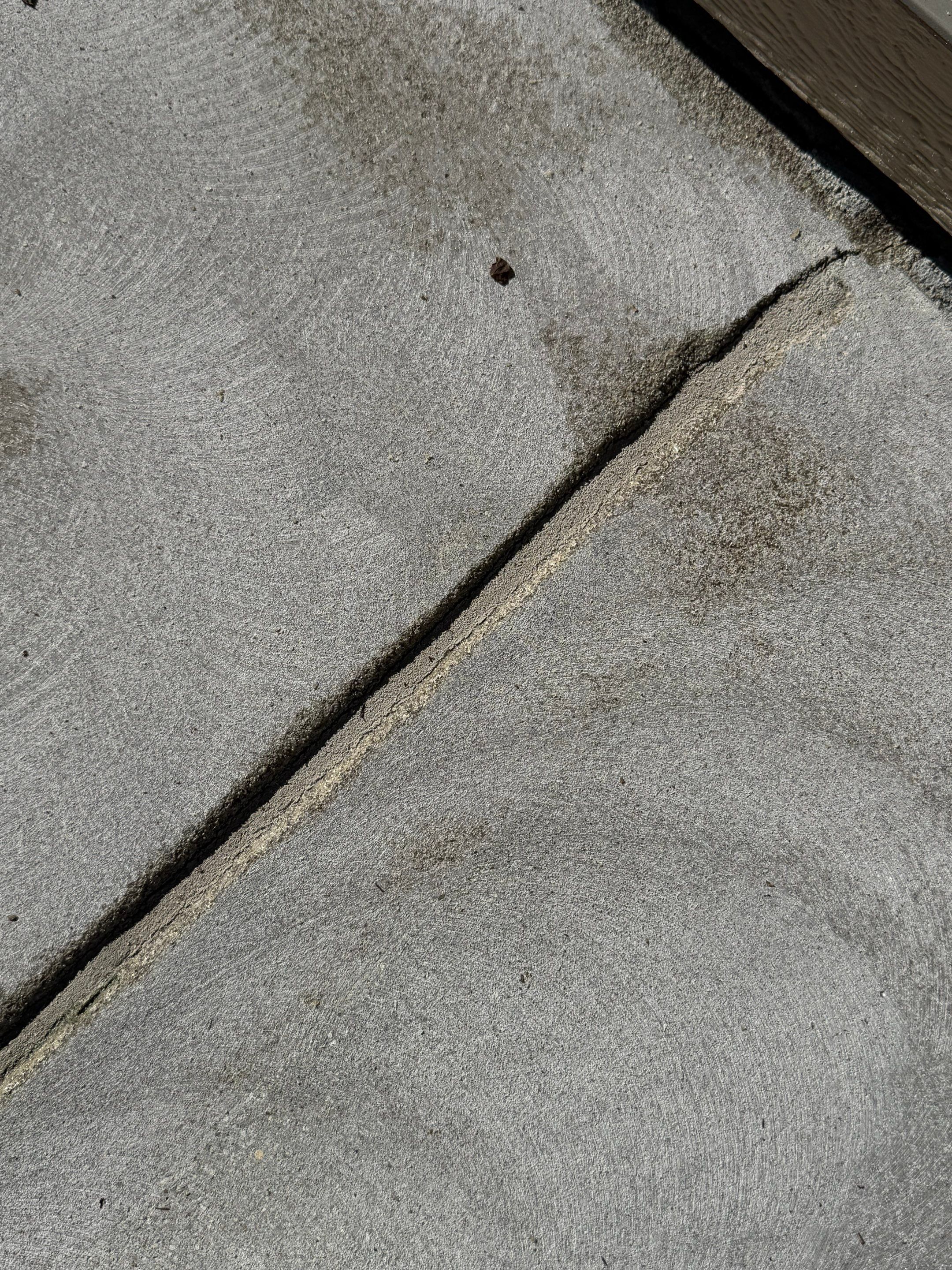 Textured Concrete Coating and Paver Patio Refresh in Sioux Falls by Select Painting, Coatings & Garage Cabinets