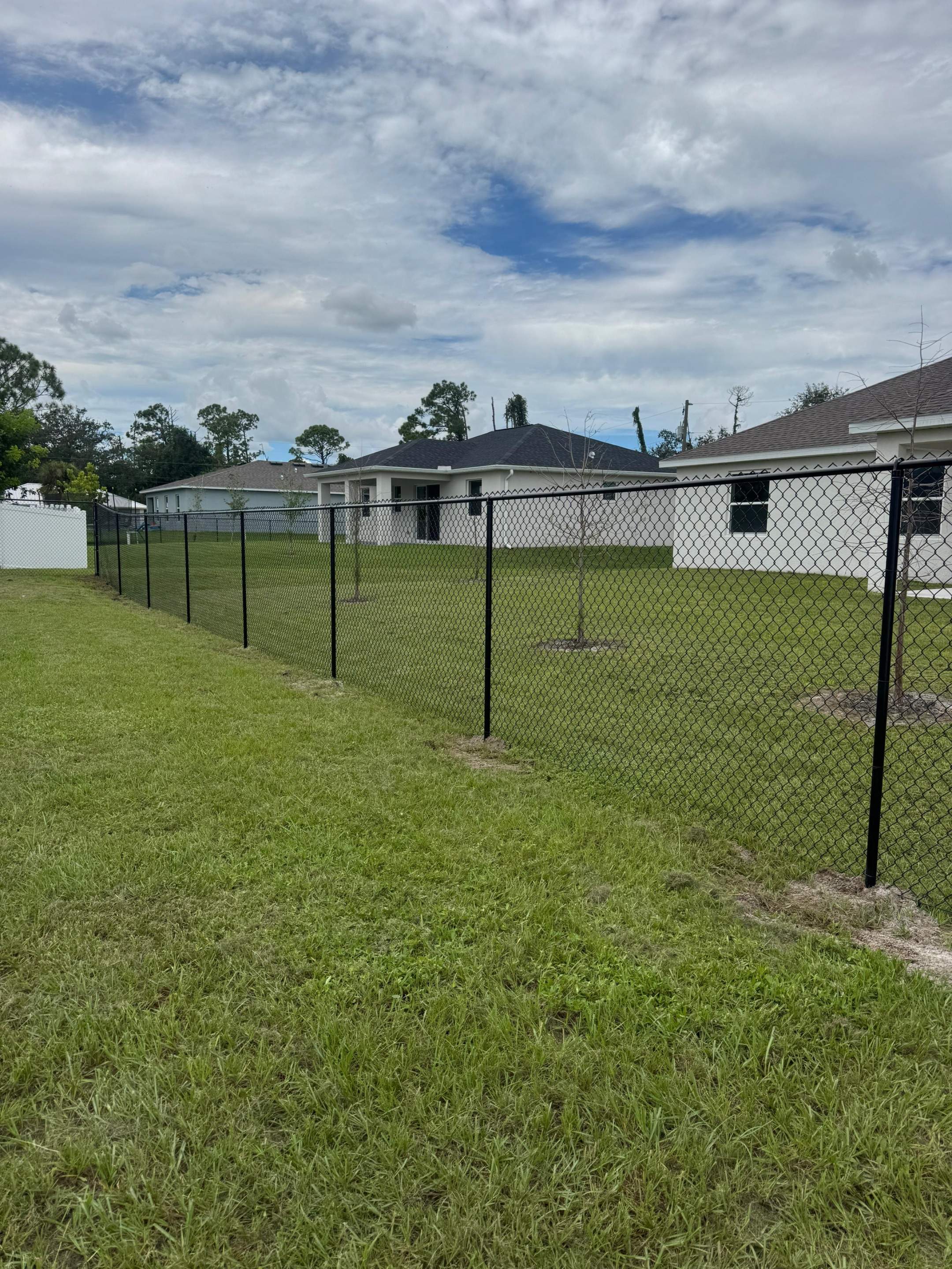 Residential Black Chain Link Fence Installation in North Port by True Fence LLC