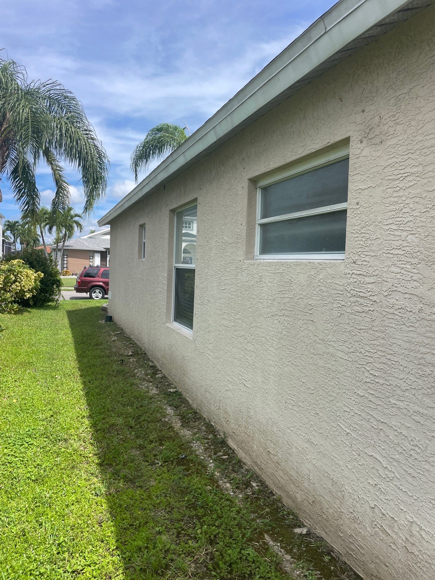White Aluminum Seamless Gutters and Downspouts in Estero FL by Gutter Professors