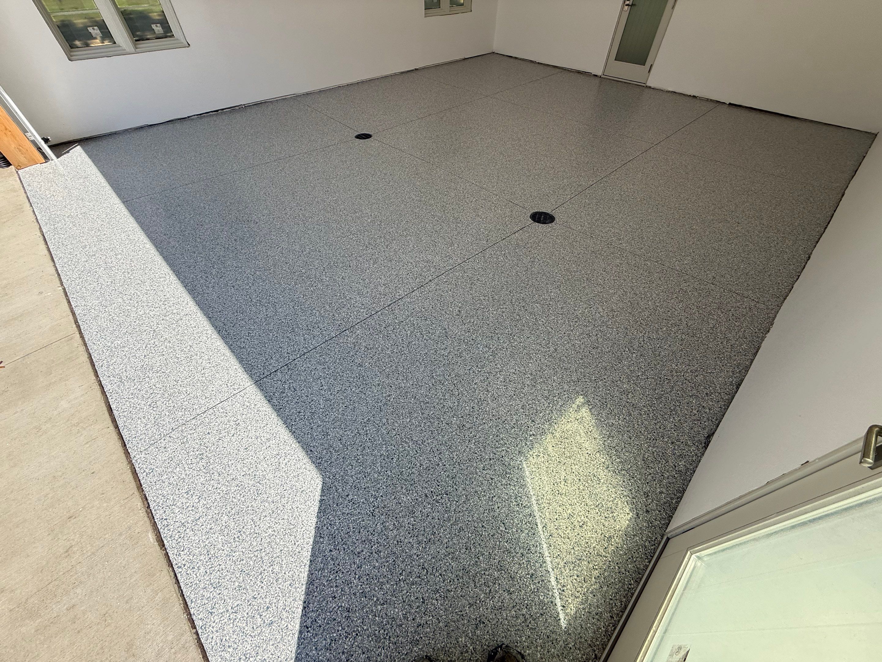 Multi-Car Garage Floor Coating Installation in Sioux Falls by Select Painting, Coatings & Garage Cabinets
