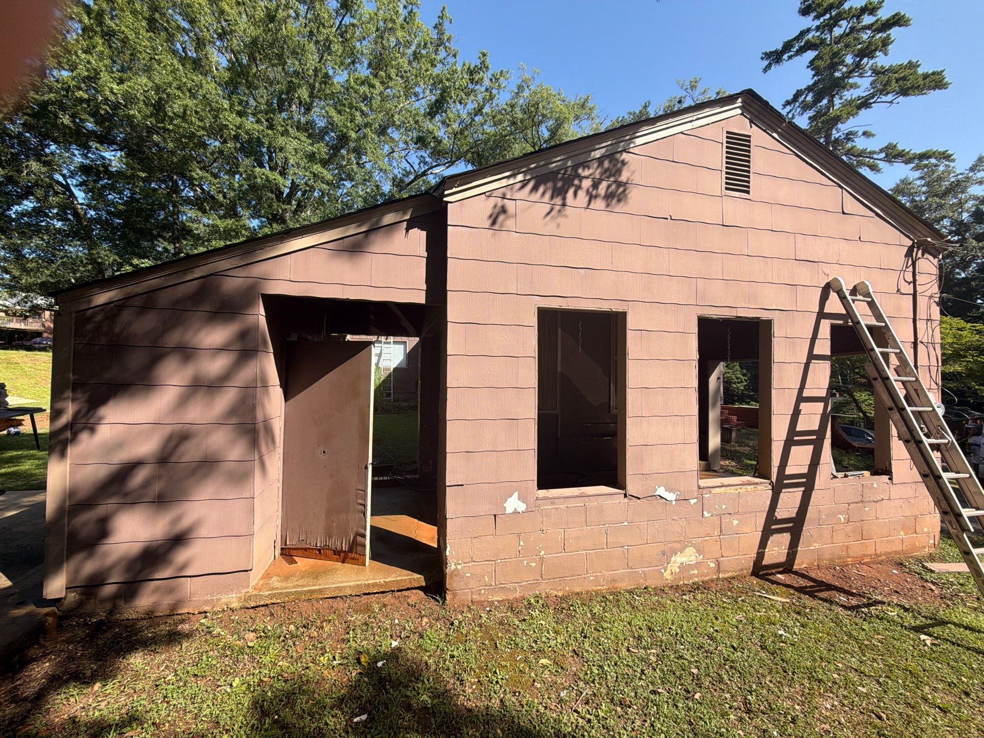 Full Exterior Repaint with Navy Blue and White Trim by Swift Home Renovations