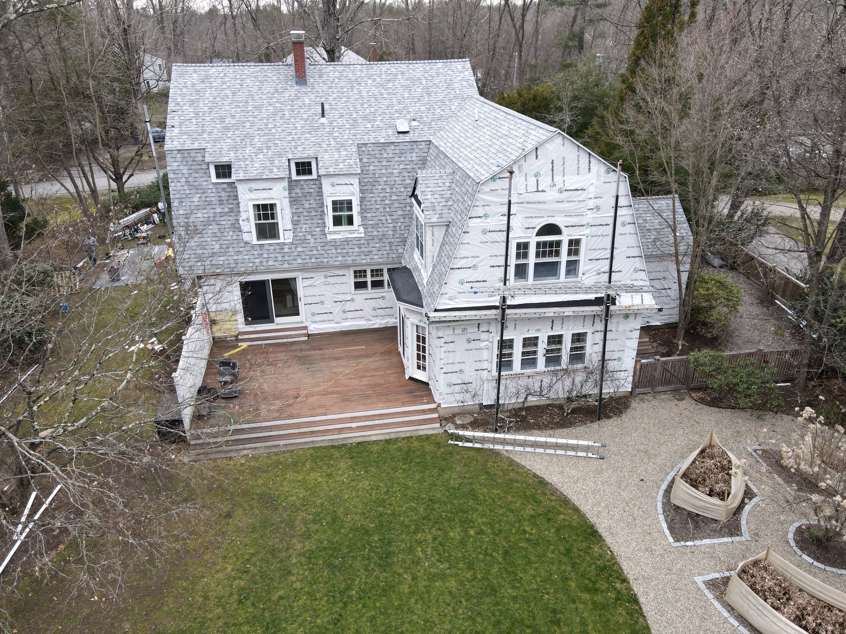 White cedar shingles and windows in Wayland, MA by UBrothers Construction