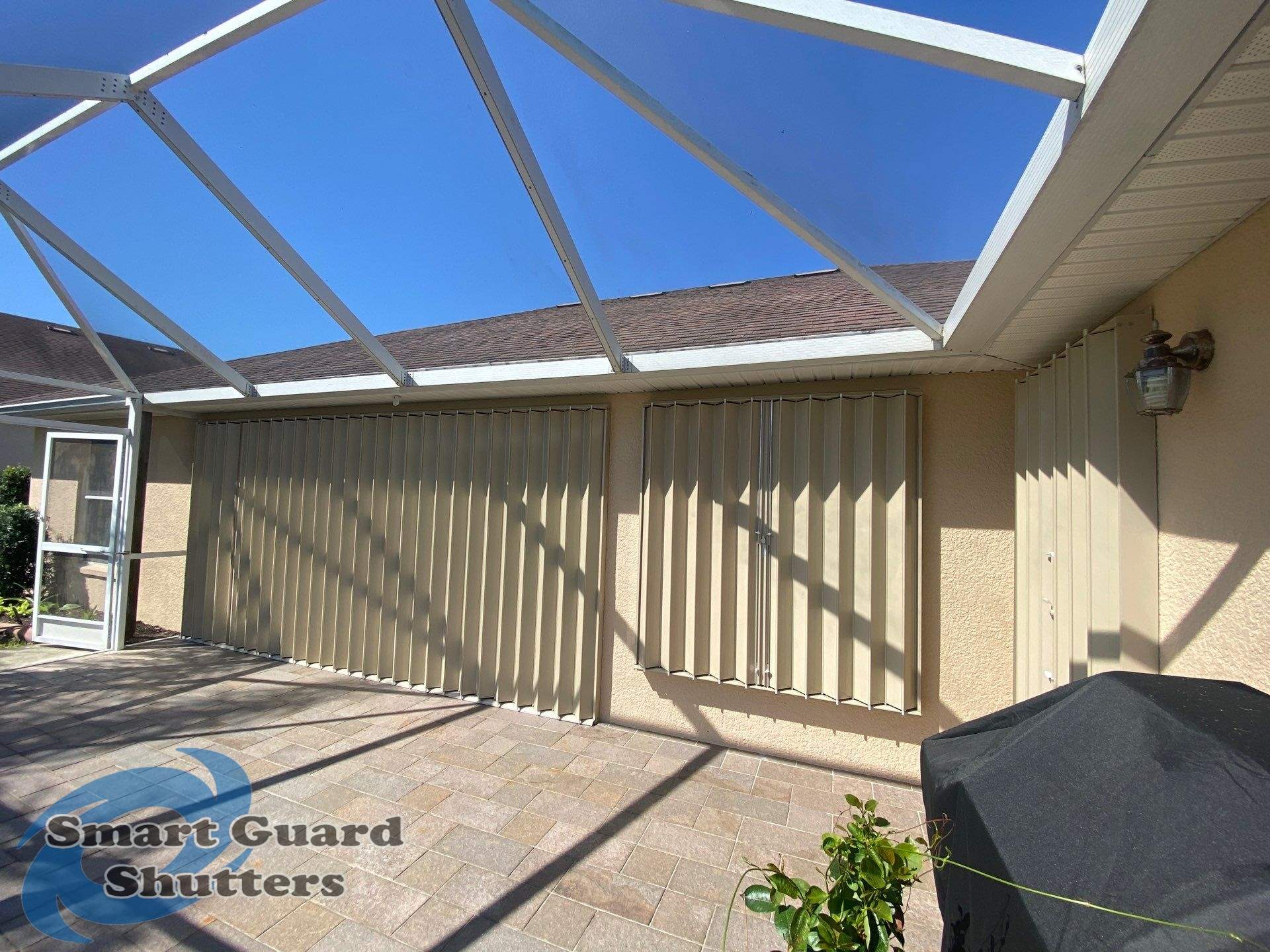 Accordions in Beige by Smart Guard Shutters