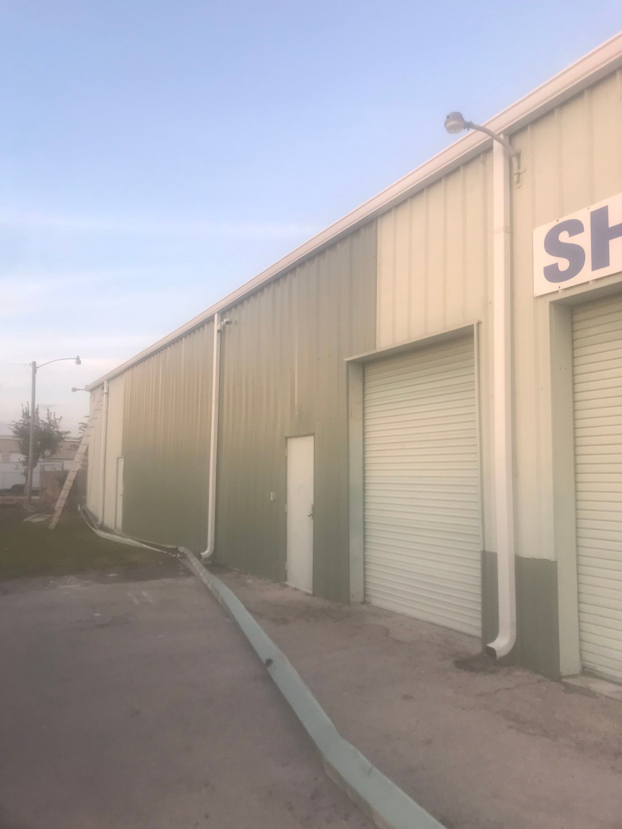 Commercial Gutters using 7 inch seamless gutters in Cape Coral FL by Gutter Professors