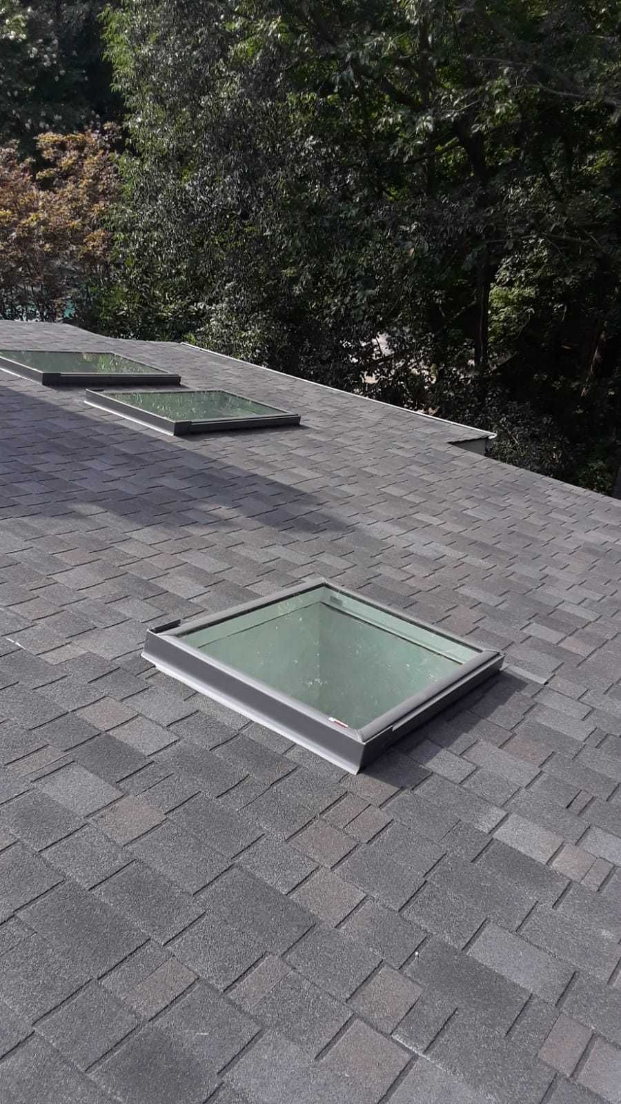 Skylight, Roof, and Gutter Replacement by American Home Contractors