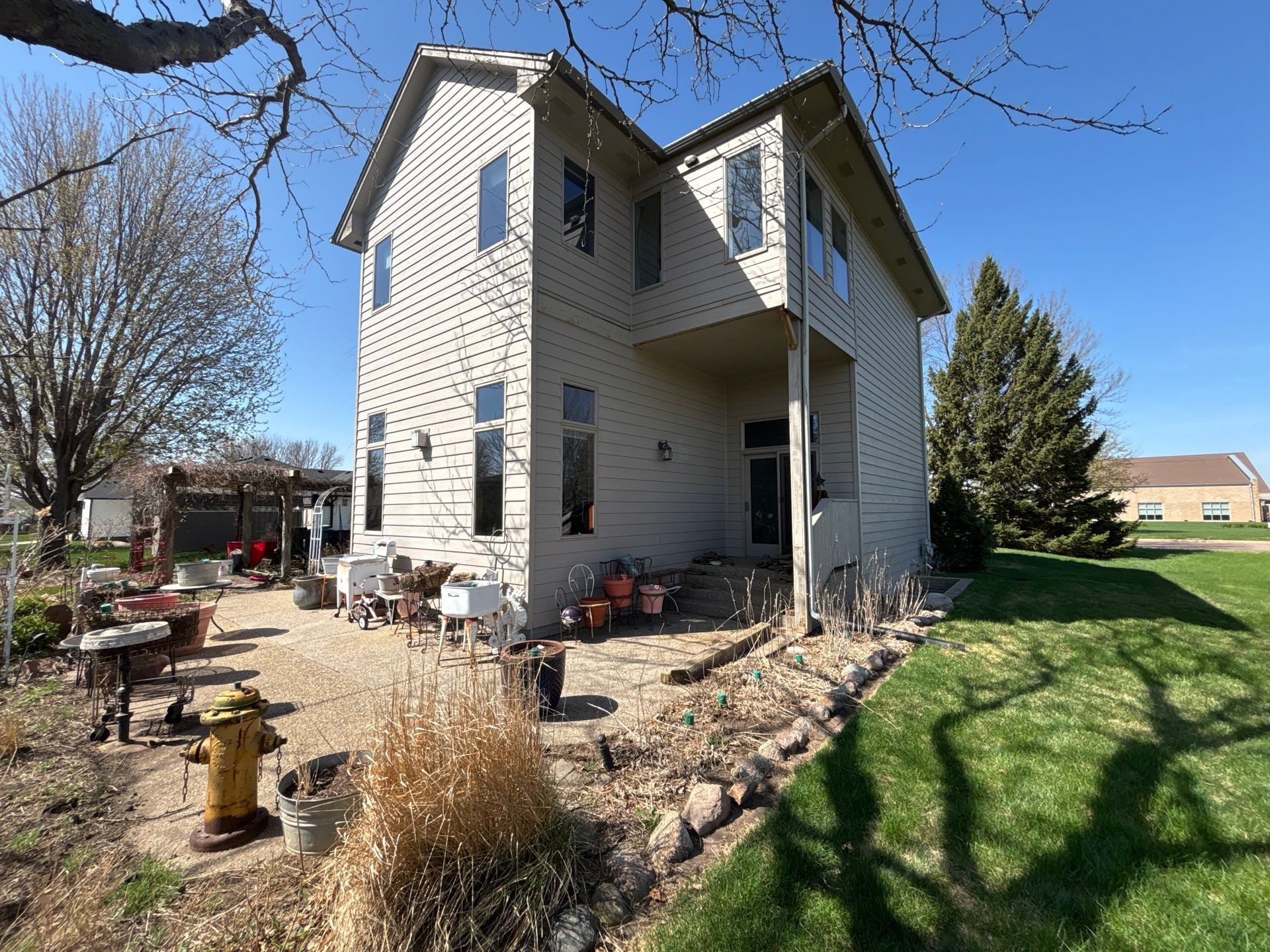 Exterior Siding and Trim Painting for Sioux Falls Residence by Select Painting, Coatings & Garage Cabinets