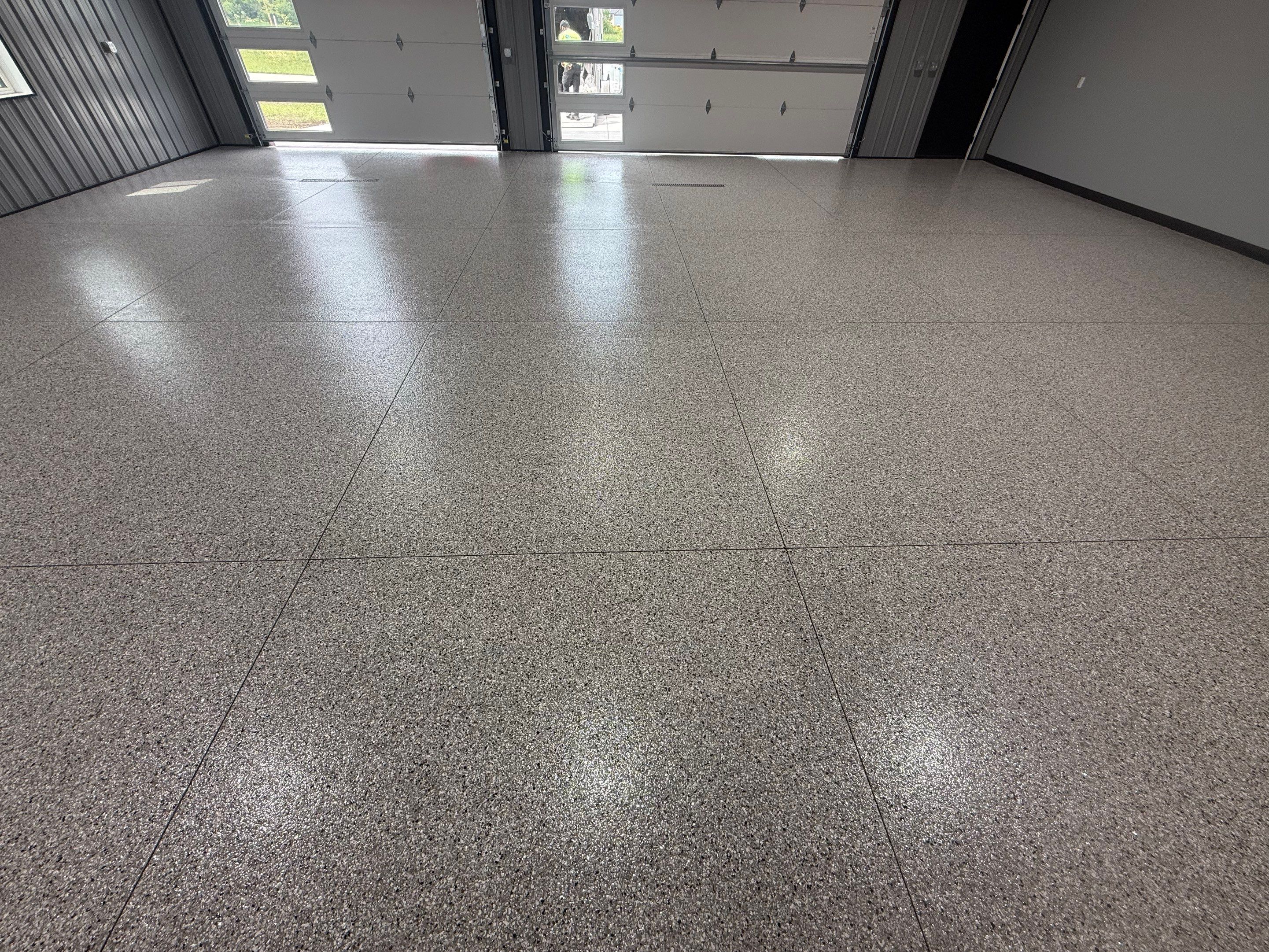 Polyaspartic Garage Floor Coating with Decorative Flake in Wentworth by Select Painting, Coatings & Garage Cabinets