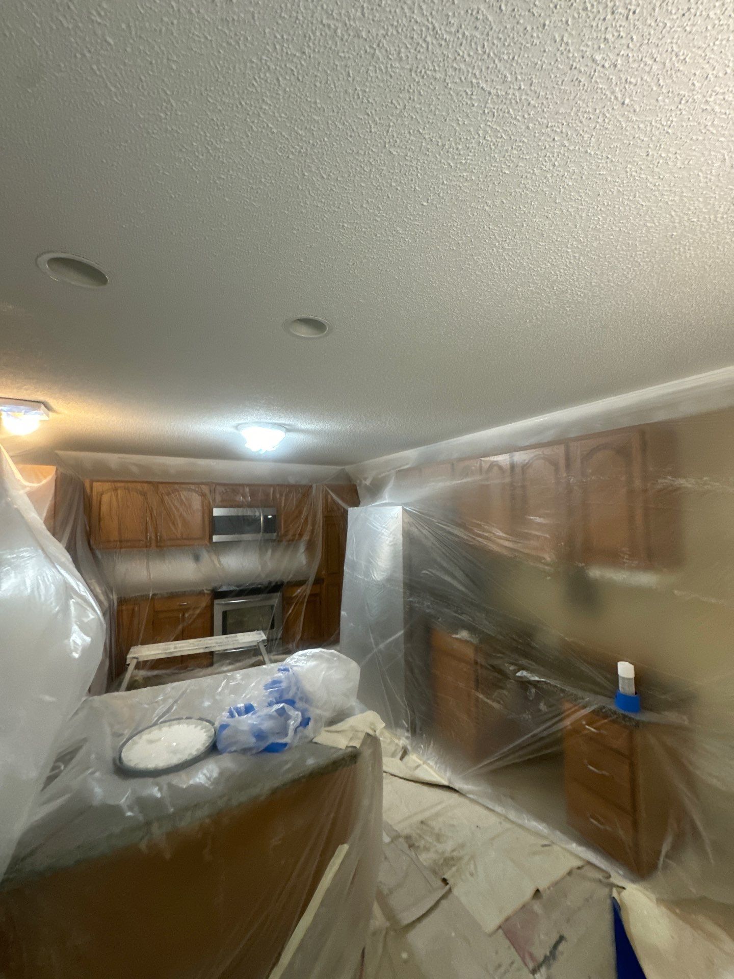 Norton Shores Kitchen Cabinet Painting and Deck Restoration Project by Gordon Painting