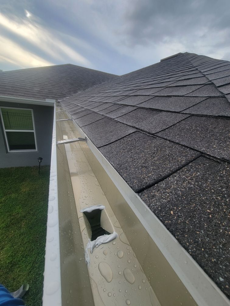 Grey Downspouts Installation in Parrish FL by Gutter Professors