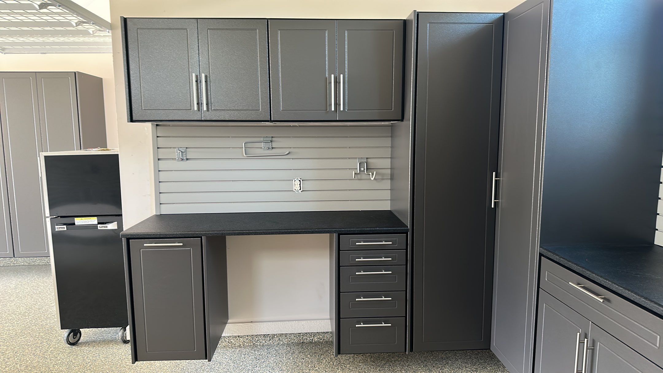 Lori H. upgrade her garage with cabinets and overhead racks by Banner Garage