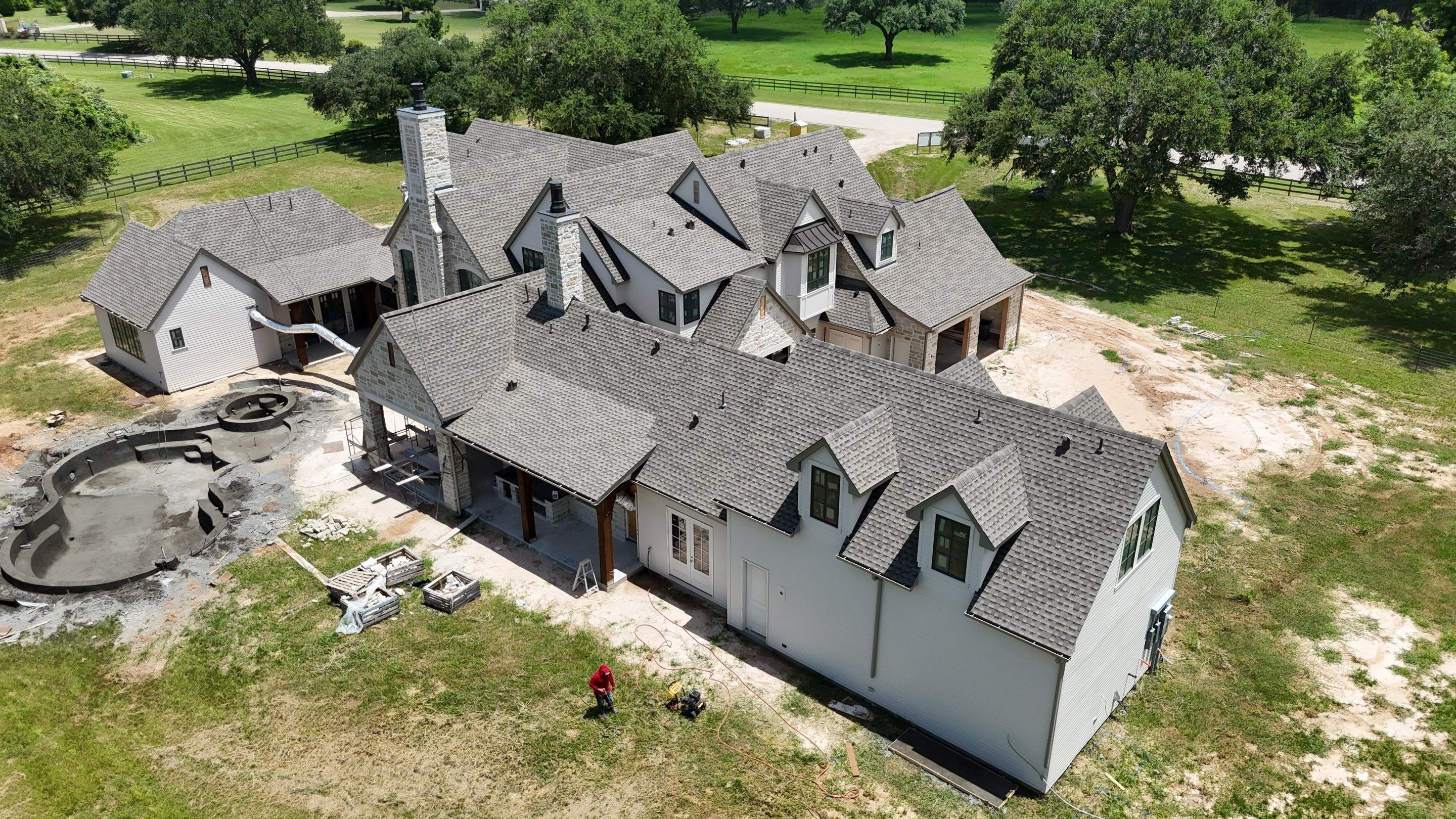 Custom home roof in Fulbrook by Level 7 Companies