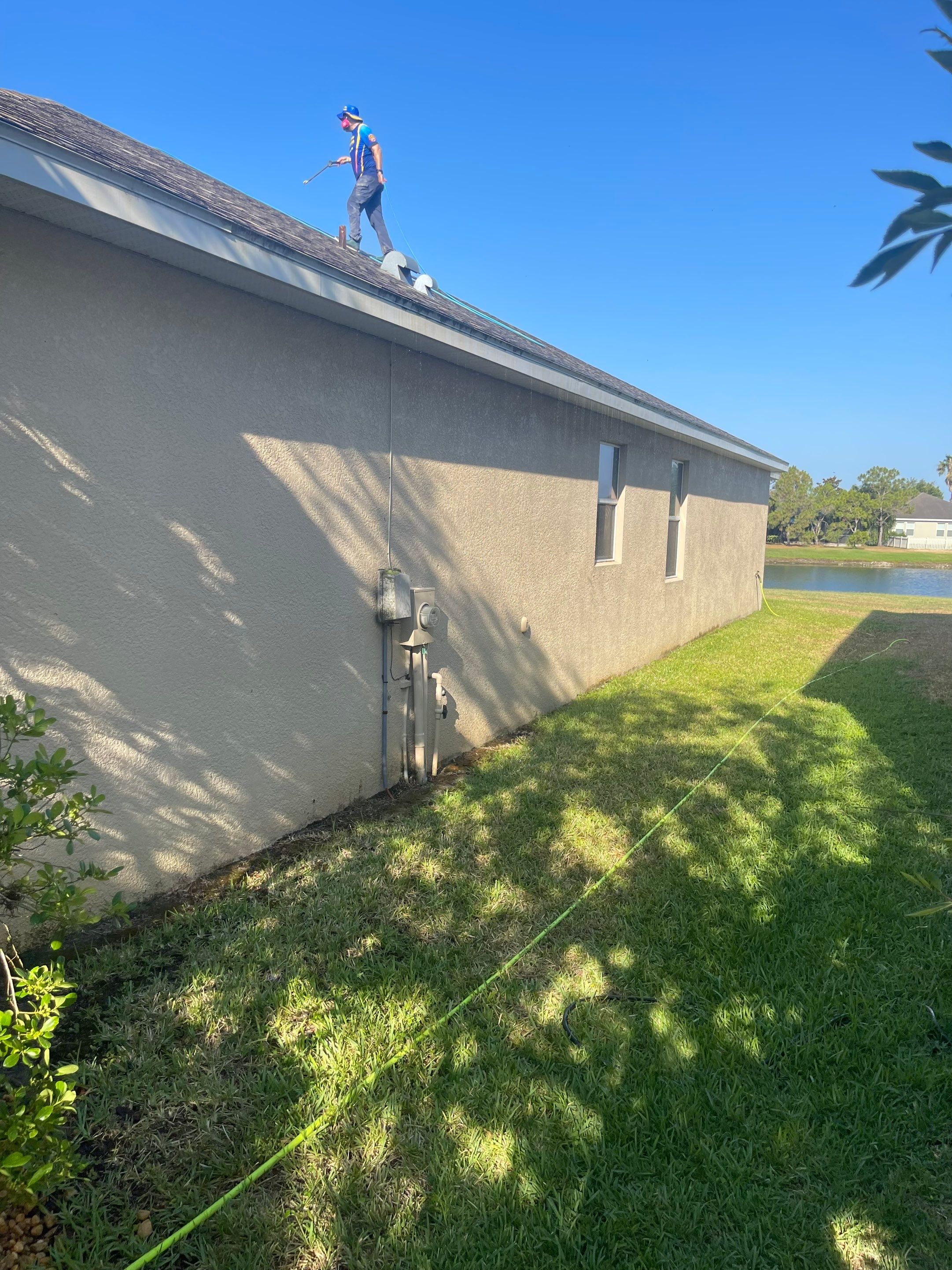 Asphalt Shingle Roof Soft Wash Cleaning & Concrete Pressure Washing in CopperStone Community, Parrish, FL by Sunshine AquaWash