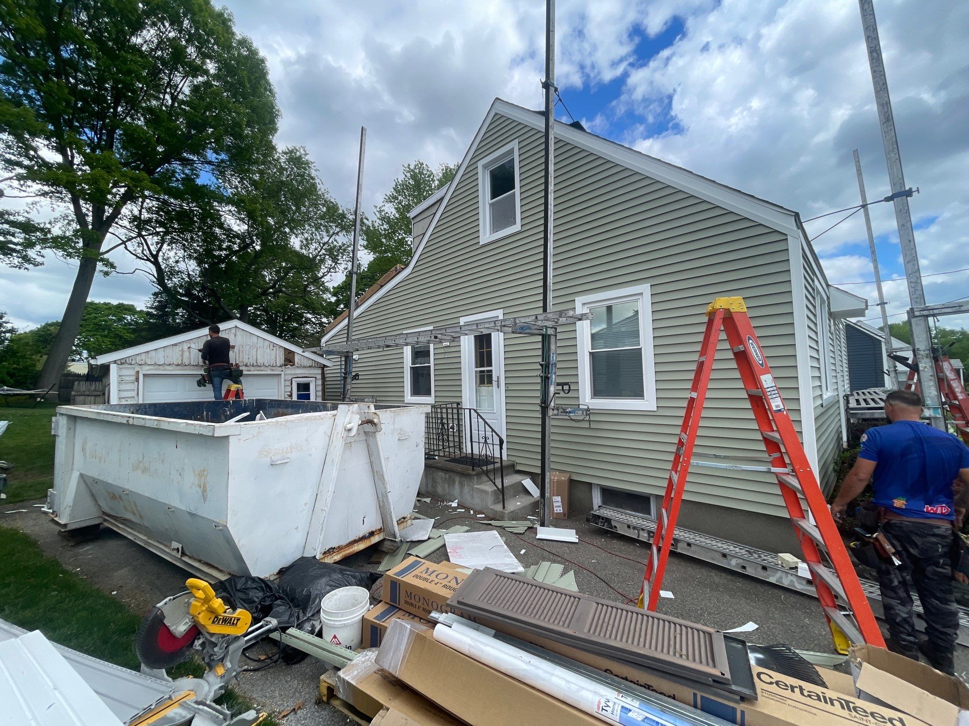 New Vinyl Siding Installation for Milford Home and Detached Garage by A Plus Exterior