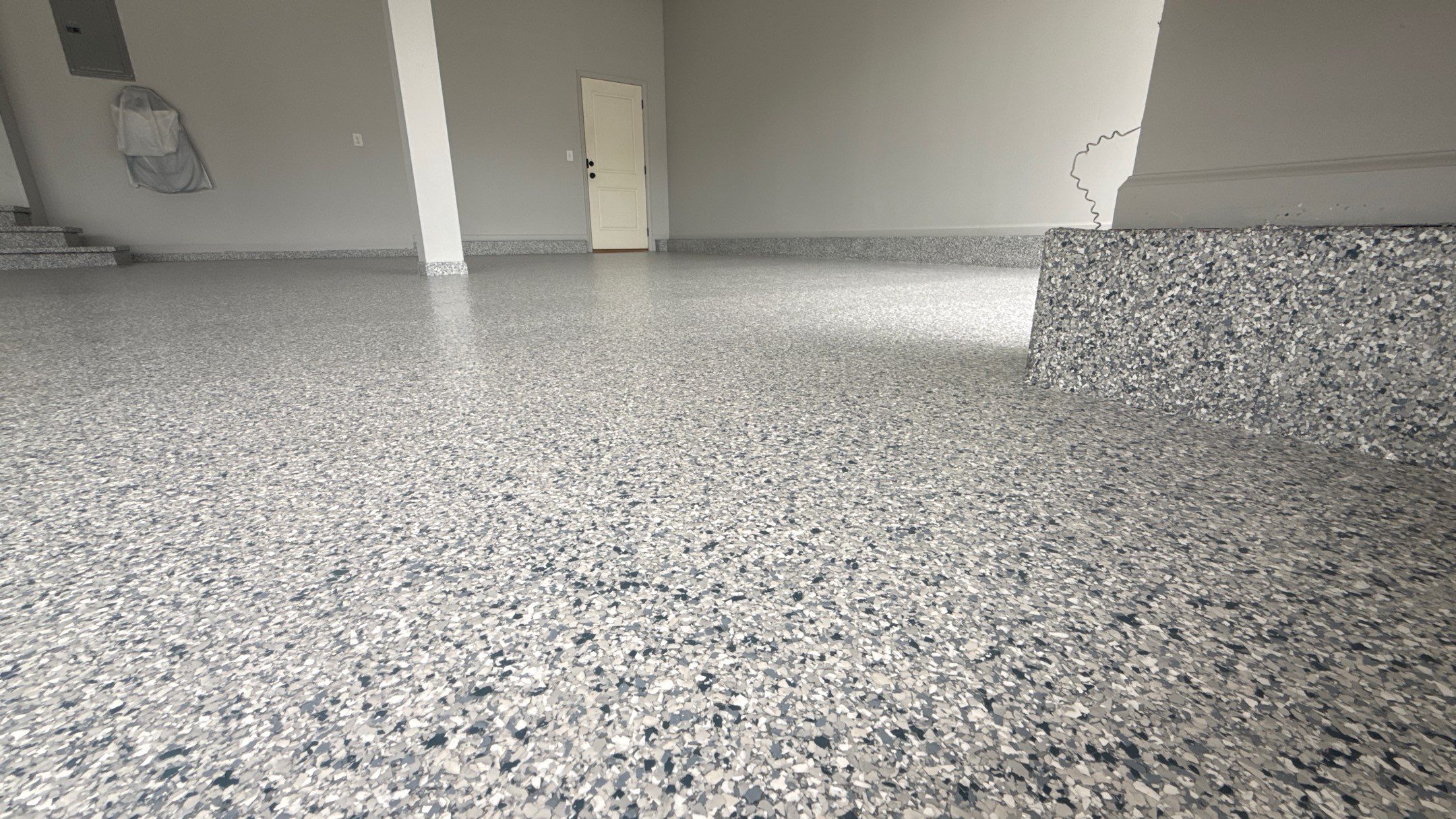 Comprehensive Garage Renovation Featuring Epoxy Flooring and Custom Storage in Shawnee by Banner Garage