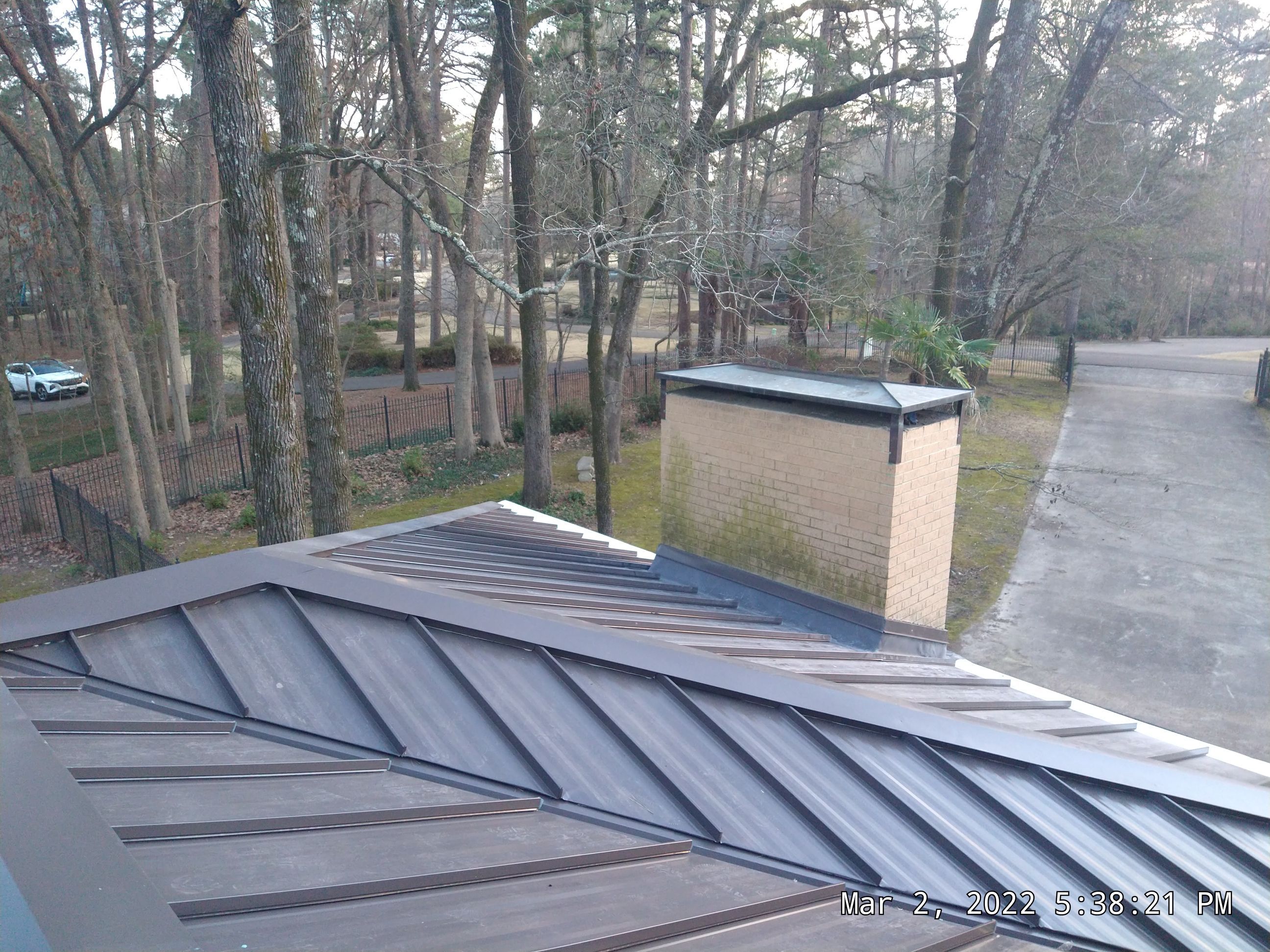 Residential Roofing Installation using PVC membrane and 24 gauge Standing Seam Metal by Hostetler Roofing